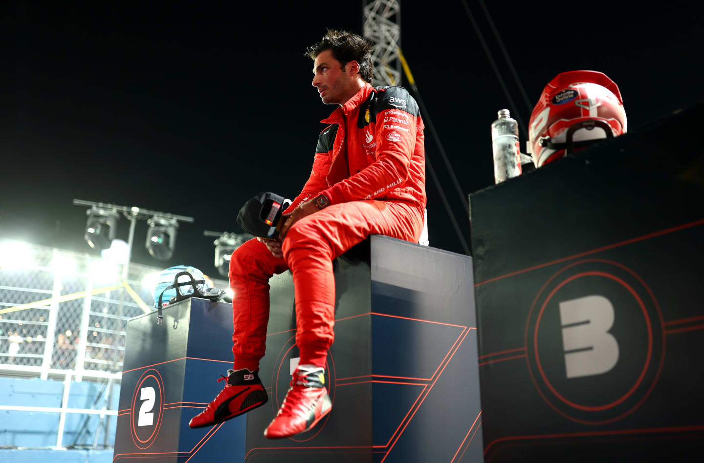 SINGAPORE, SINGAPORE - SEPTEMBER 16: Pole position qualifier Carlos Sainz of Spain and Ferrari looks on in parc ferme during qualifying ahead of the F1 Grand Prix of Singapore at Marina Bay Street Circuit on September 16, 2023 in Singapore, Singapore. (Photo by Dan Istitene - Formula 1/Formula 1 via Getty Images)