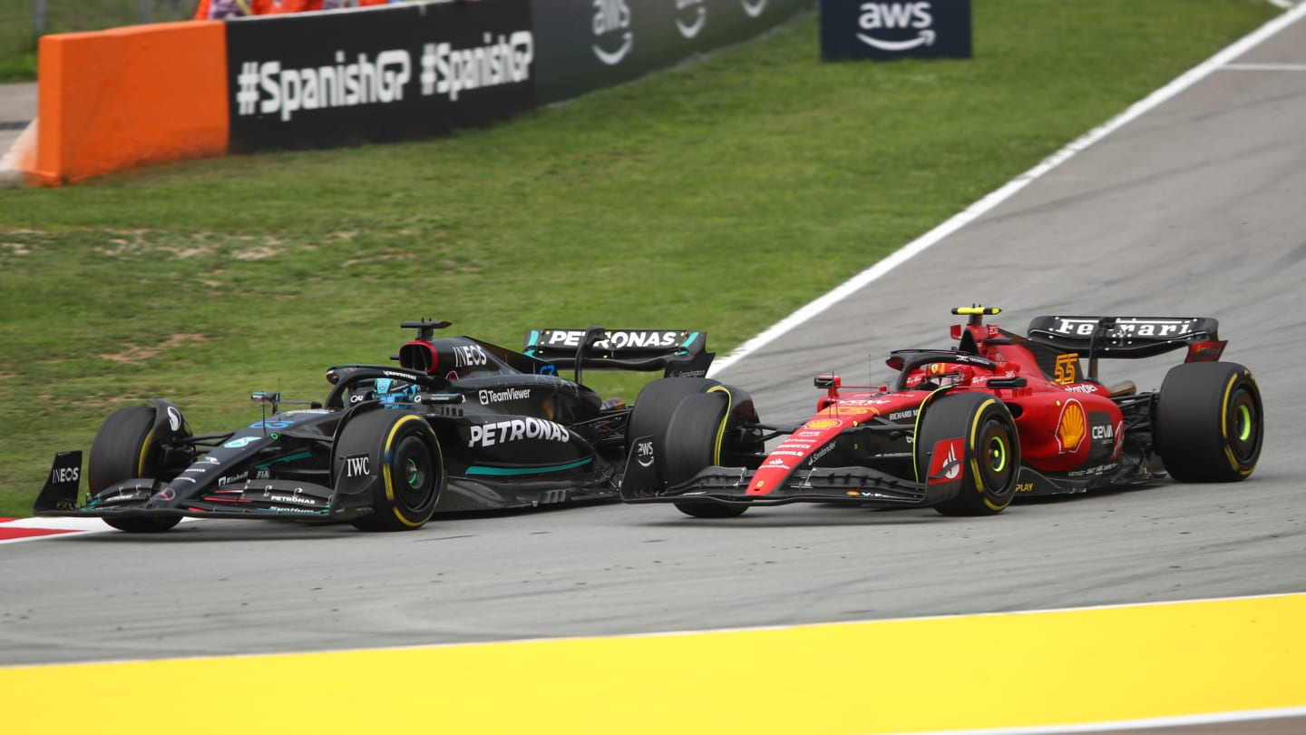 BARCELONA, SPAIN - JUNE 04: George Russell of Great Britain driving the (63) Mercedes AMG Petronas F1 Team W14 leads Carlos Sainz of Spain driving (55) the Ferrari SF-23 on track during the F1 Grand Prix of Spain at Circuit de Barcelona-Catalunya on June 04, 2023 in Barcelona, Spain. (Photo by Joe Portlock - Formula 1/Formula 1 via Getty Images)