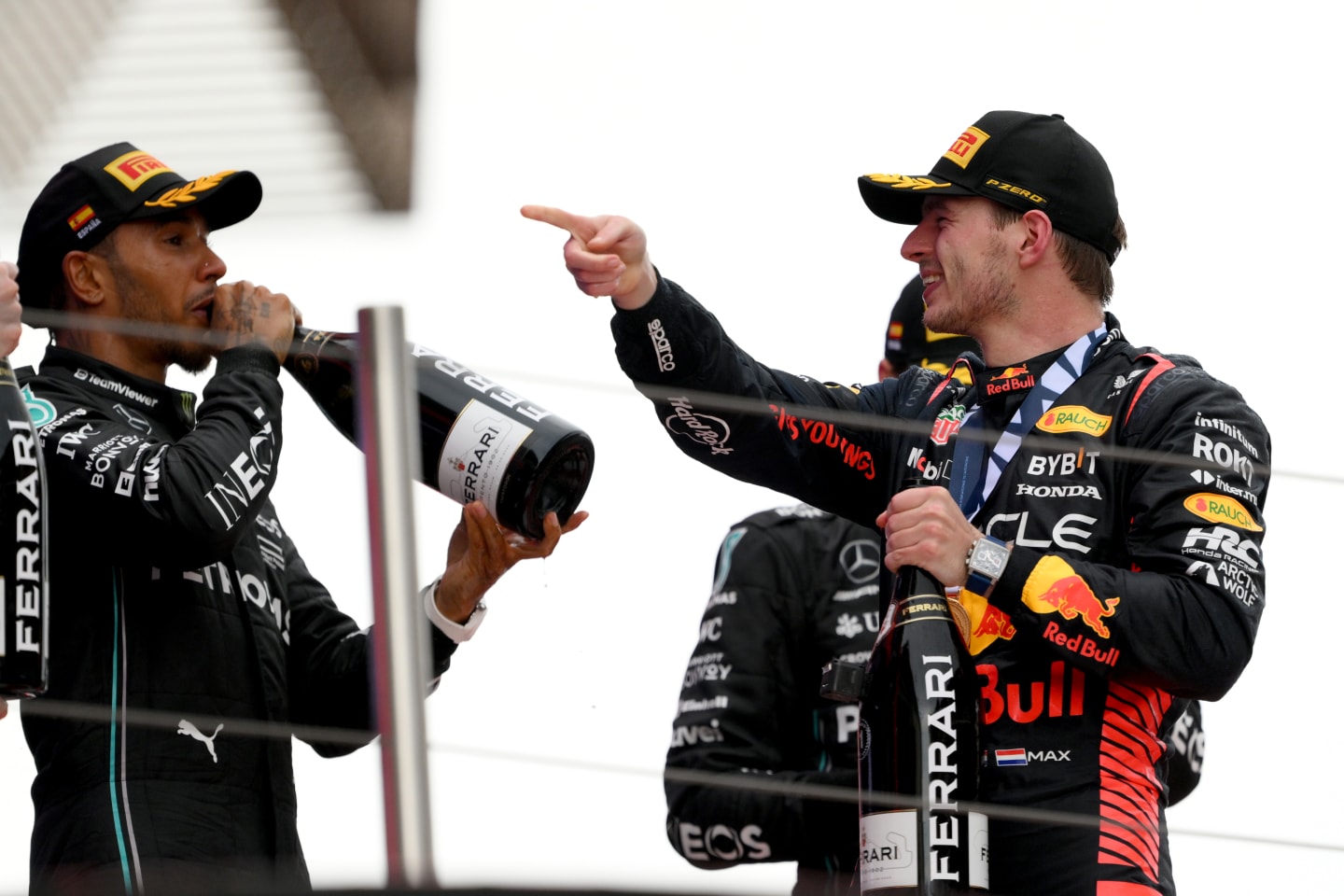 BARCELONA, SPAIN - JUNE 04: Race Winner Max Verstappen of the Netherlands and Oracle Red Bull Racing and Second placed Lewis Hamilton of Great Britain and Mercedes celebrate on the podium during the F1 Grand Prix of Spain at Circuit de Barcelona-Catalunya on June 04, 2023 in Barcelona, Spain. (Photo by David Ramos/Getty Images)