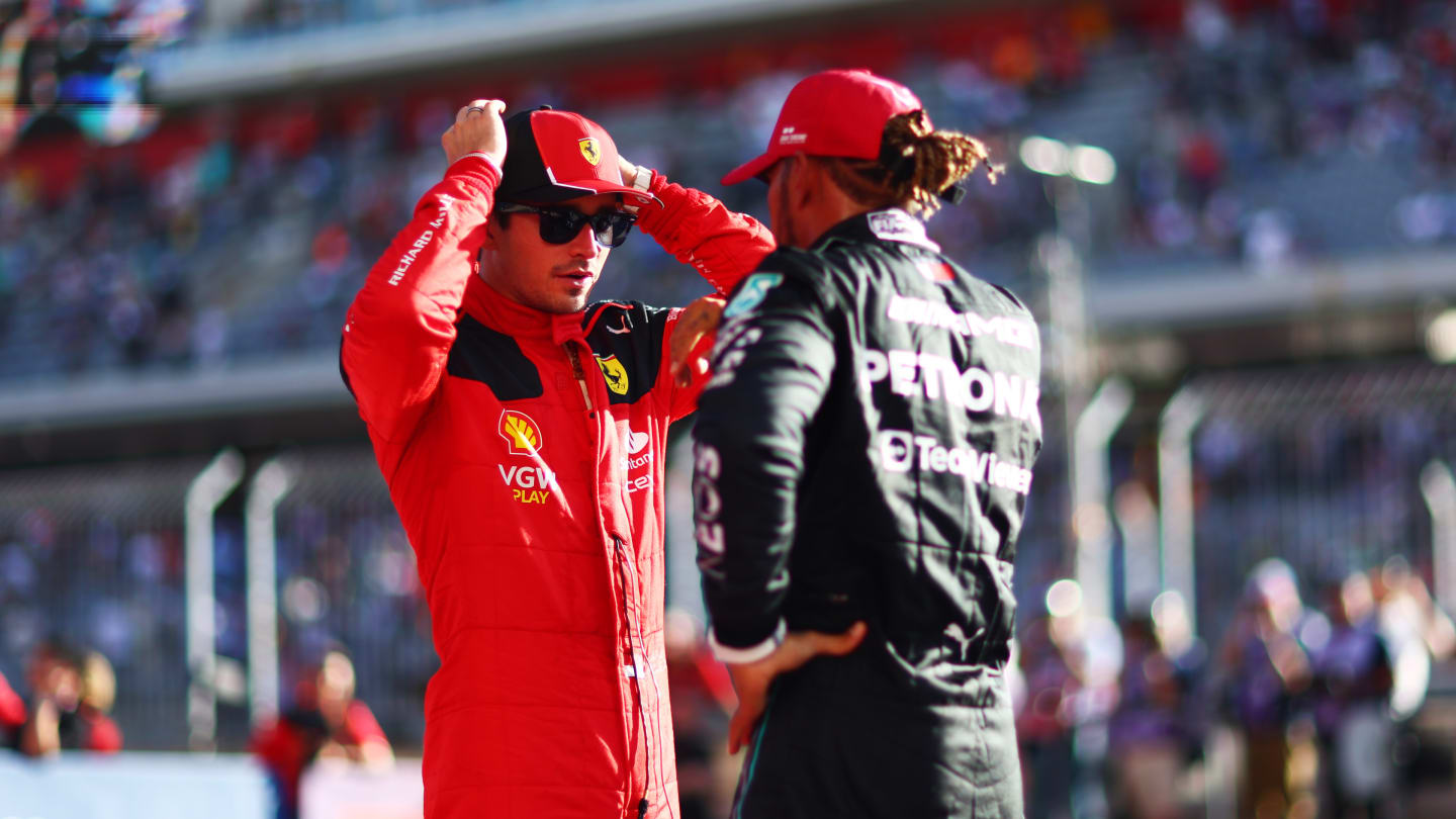 AUSTIN, TEXAS - OCTOBER 20: Pole position qualifier Charles Leclerc of Monaco and Ferrari speaks to third placed qualifier Lewis Hamilton of Great Britain and Mercedes in parc ferme after qualifying ahead of the F1 Grand Prix of United States at Circuit of The Americas on October 20, 2023 in Austin, Texas. (Photo by Dan Istitene - Formula 1/Formula 1 via Getty Images)