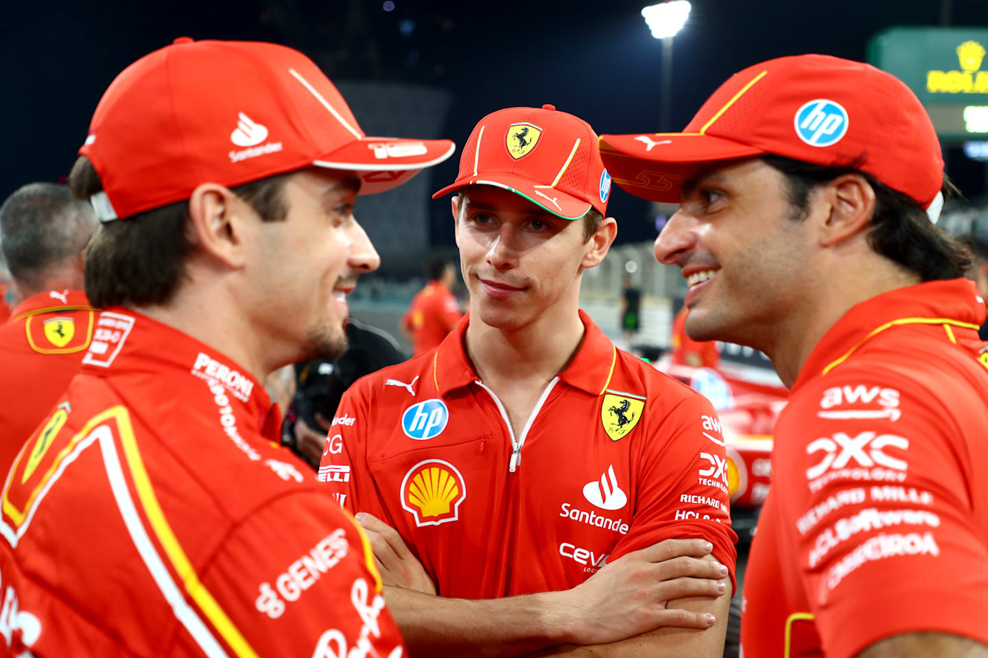 Charles Leclerc, Carlos Sainz and Arthur Leclerc talk in the Paddock ahead of the F1 Grand Prix of Abu Dhabi at Yas Marina Circuit on December 05, 2024 in Abu Dhabi, United Arab Emirates. (Photo by Peter Fox - Formula 1/Formula 1 via Getty Images)