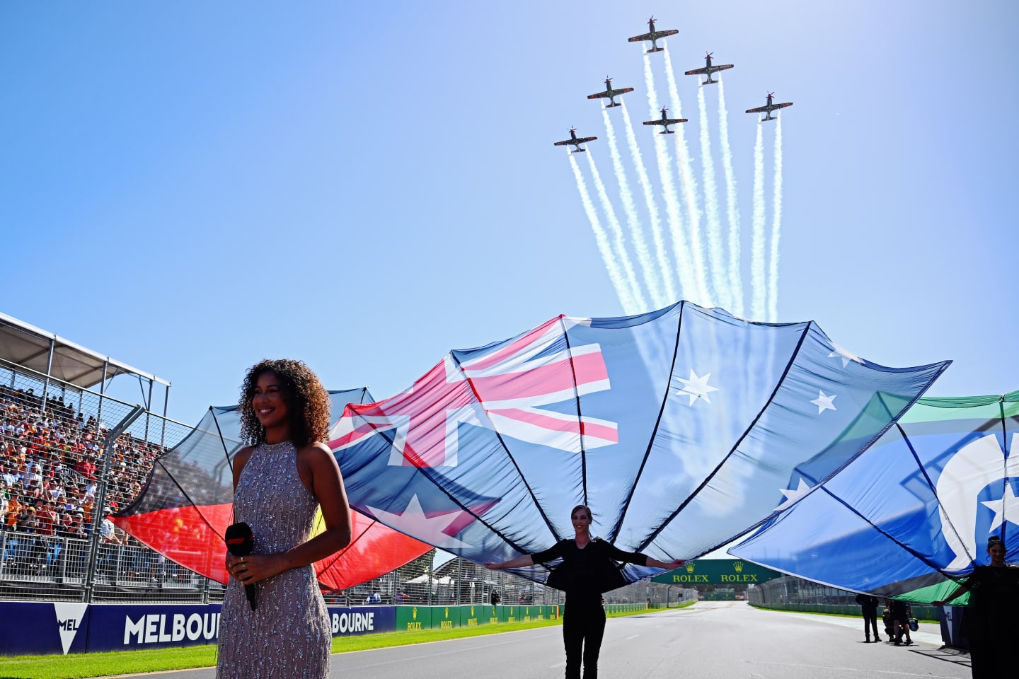 MELBOURNE, AUSTRALIA - MARCH 24: An aerial display is seen above the national anthem performer on