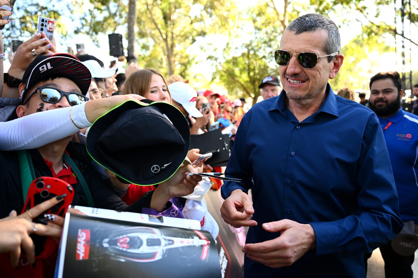 MELBOURNE, AUSTRALIA - MARCH 22: Guenther Steiner greets fans on the Melbourne Walk prior to