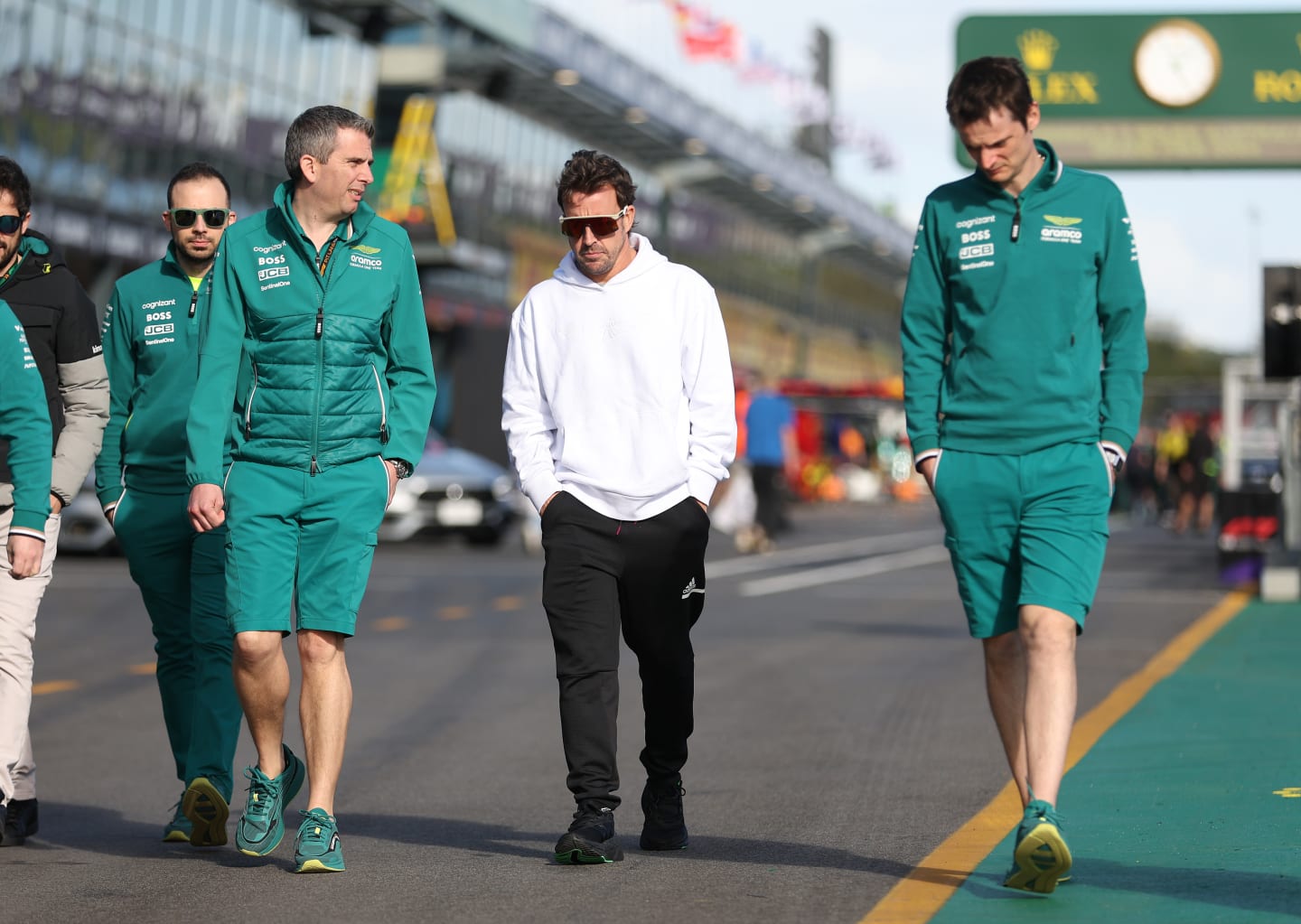 MELBOURNE, AUSTRALIA - MARCH 21: Fernando Alonso of Spain and Aston Martin walks the circuit during