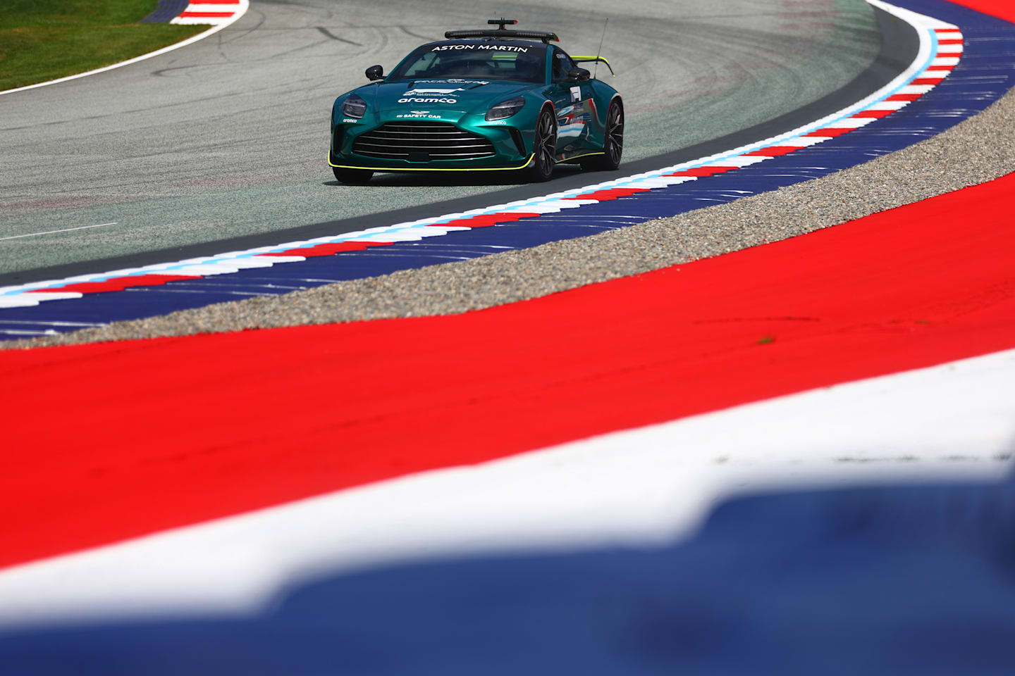 SPIELBERG, AUSTRIA - JUNE 27: The FIA Safety Car drives past a newly installed gravel trap during