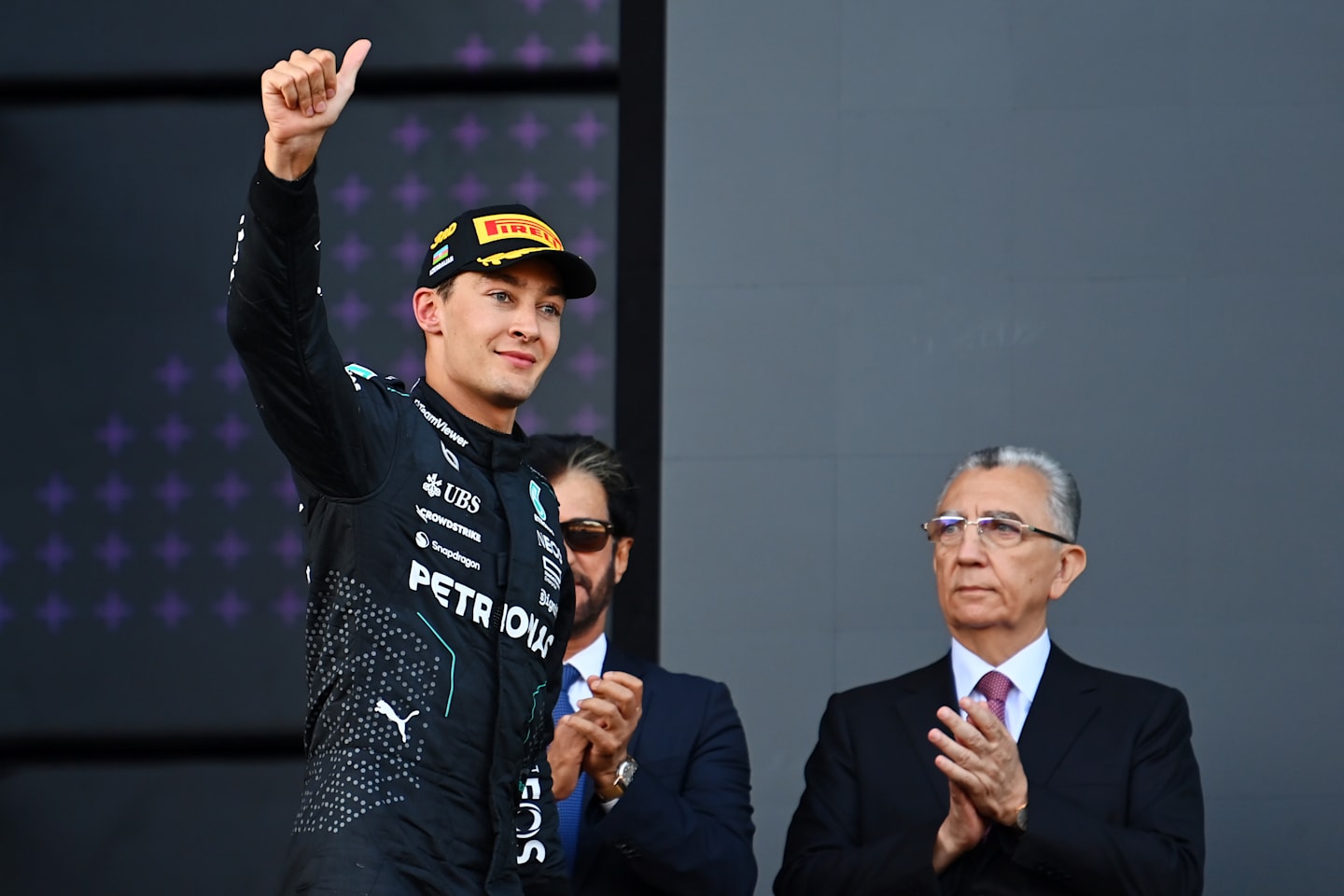 BAKU, AZERBAIJAN - SEPTEMBER 15: Third placed George Russell of Great Britain and Mercedes celebrates on the podium during the F1 Grand Prix of Azerbaijan at Baku City Circuit on September 15, 2024 in Baku, Azerbaijan. (Photo by James Sutton/Getty Images)