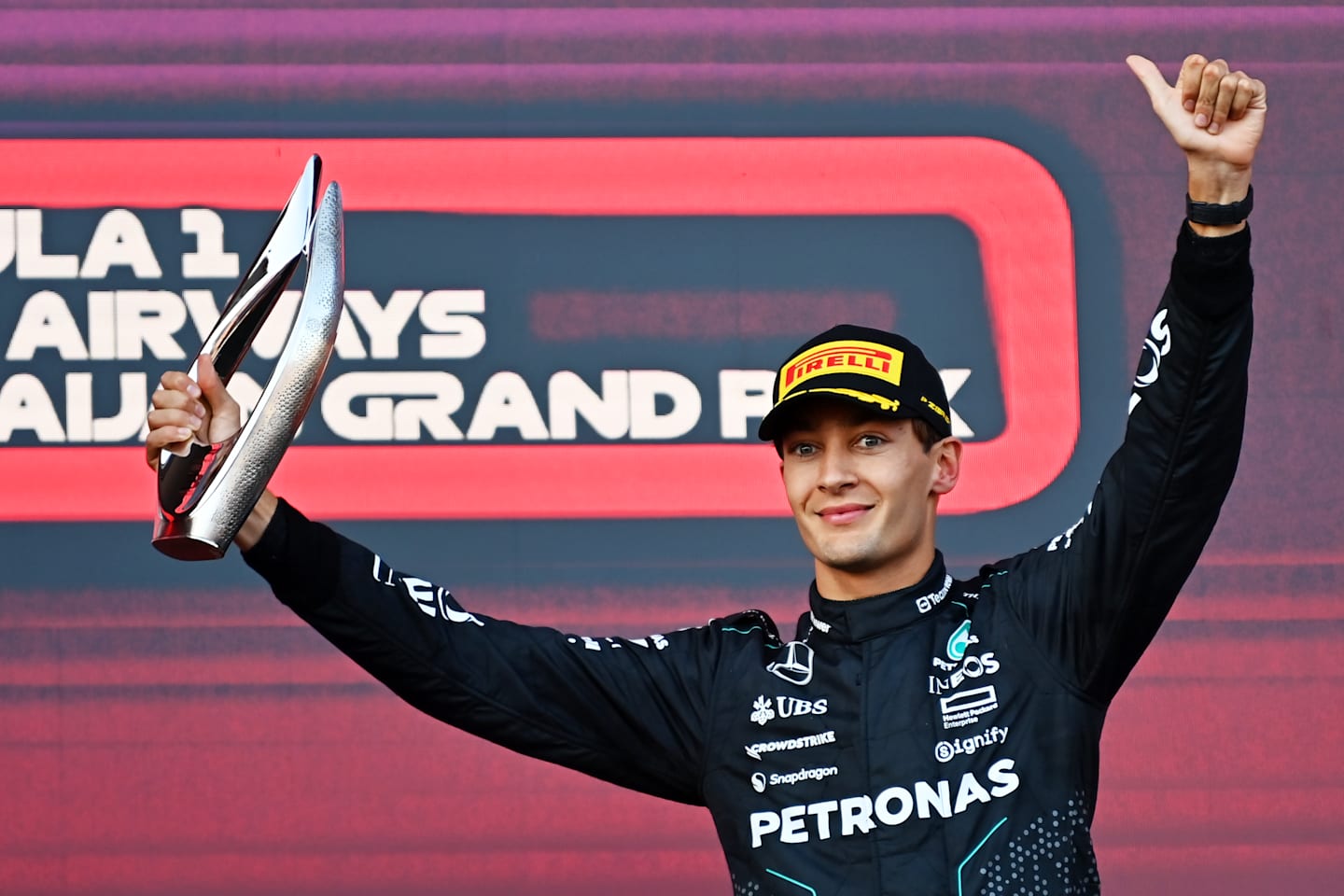 BAKU, AZERBAIJAN - SEPTEMBER 15: Third placed George Russell of Great Britain and Mercedes celebrates on the podium during the F1 Grand Prix of Azerbaijan at Baku City Circuit on September 15, 2024 in Baku, Azerbaijan. (Photo by James Sutton/Getty Images)