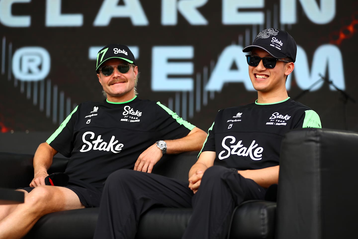 BAKU, AZERBAIJAN - SEPTEMBER 13: Valtteri Bottas and Zhou Guanyu talk to the crowd on the fan stage prior to practice ahead of the F1 Grand Prix of Azerbaijan on September 13, 2024. (Photo by Peter Fox - Formula 1/Formula 1 via Getty Images)