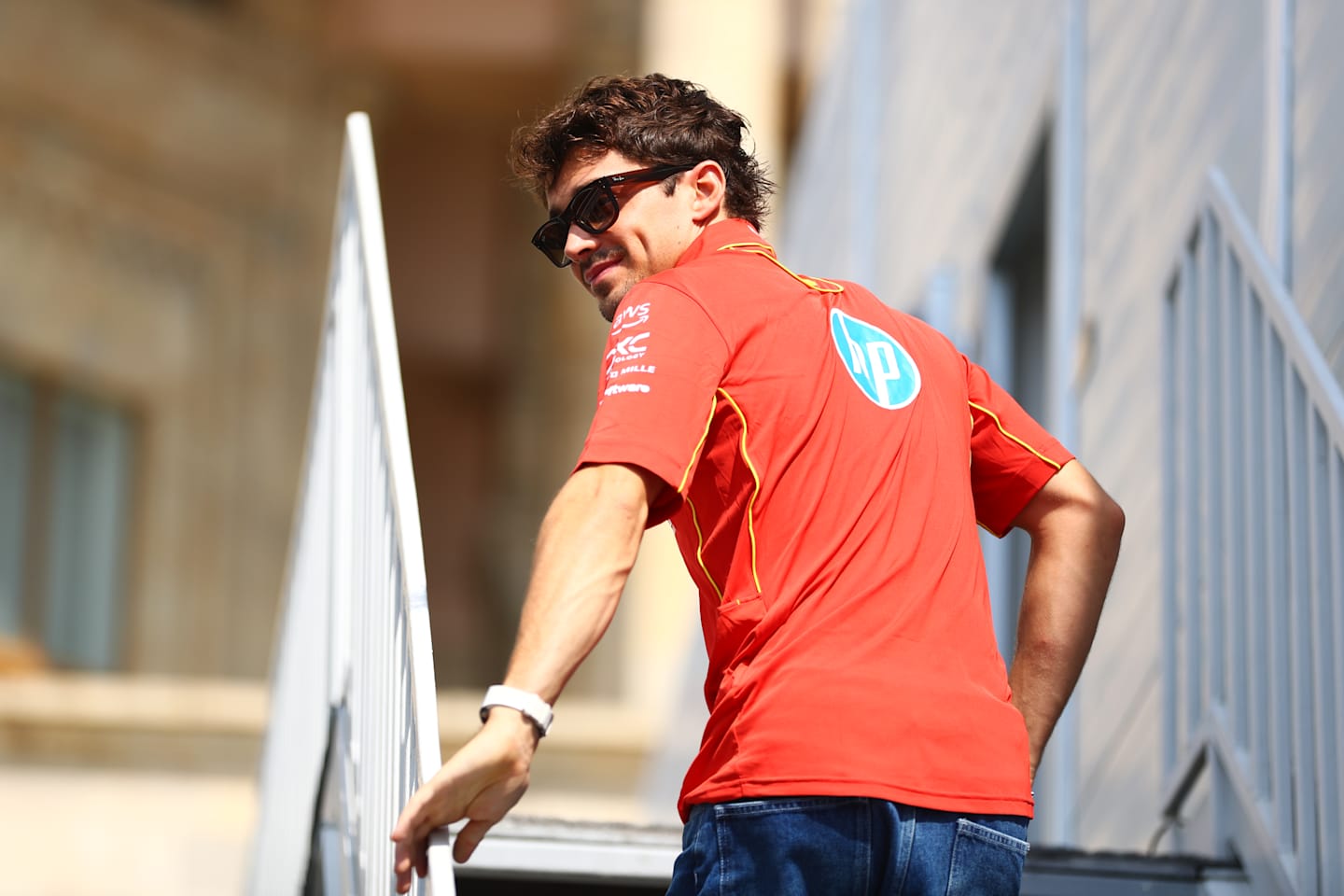 BAKU, AZERBAIJAN - SEPTEMBER 12: Charles Leclerc of Monaco and Ferrari looks on in the Paddock