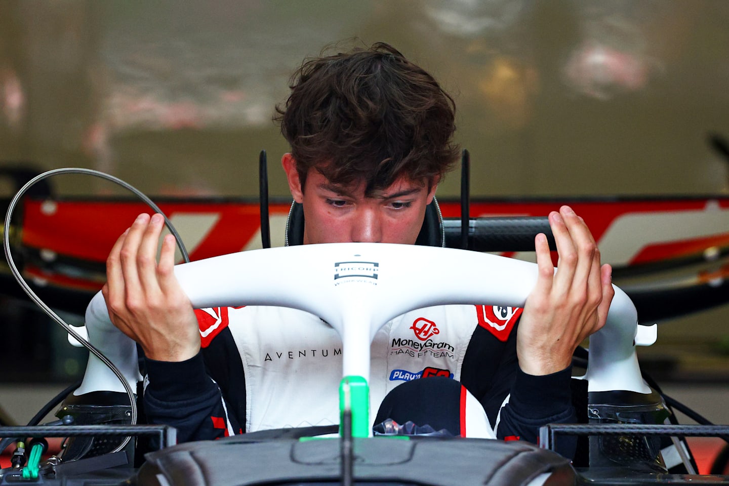 BAKU, AZERBAIJAN - SEPTEMBER 12: Oliver Bearman of Great Britain and Haas F1 has a seat fitting in the garage during previews ahead of the F1 Grand Prix of Azerbaijan at Baku City Circuit. (Photo by Clive Rose - Formula 1/Formula 1 via Getty Images)