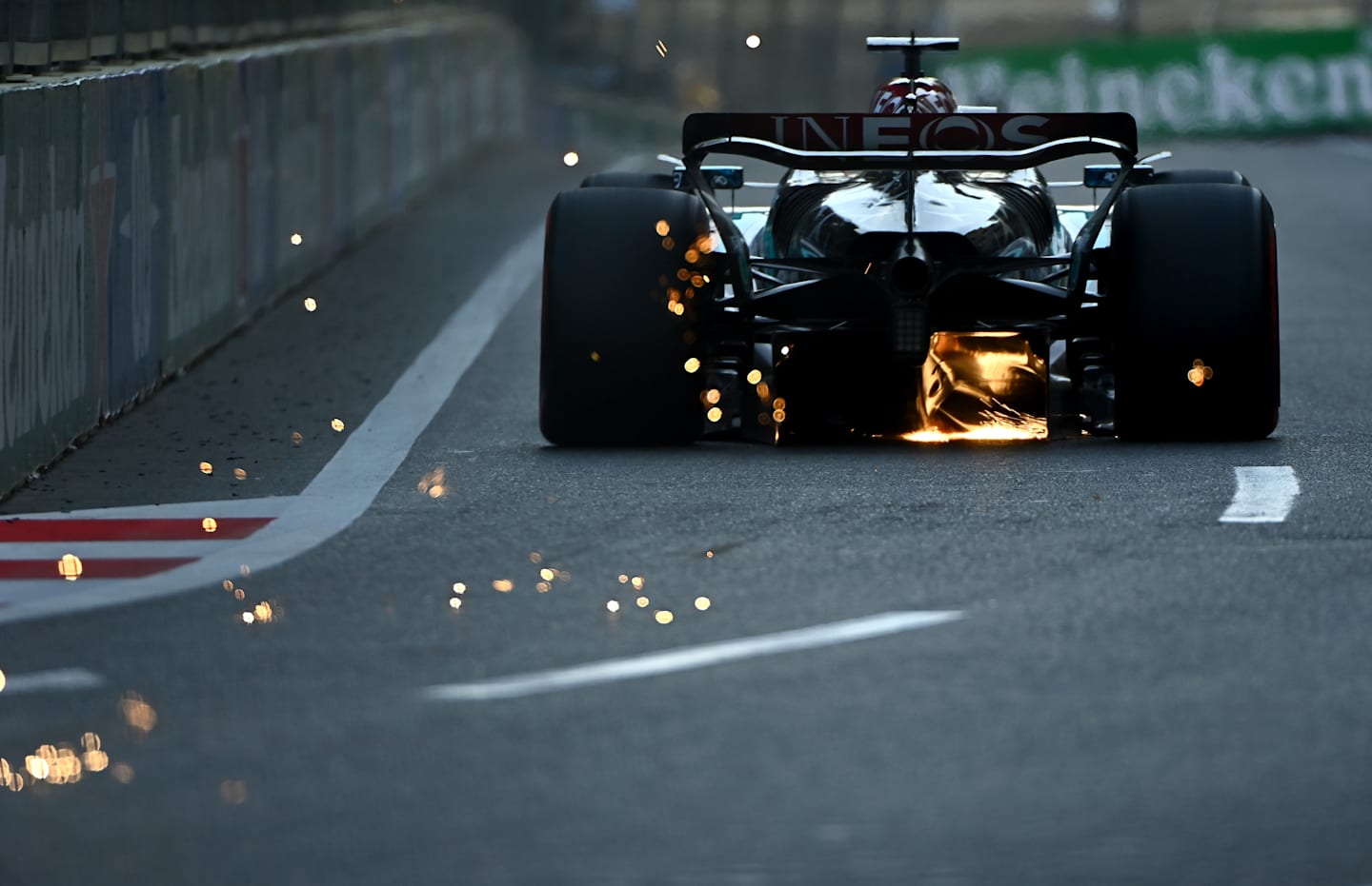 BAKU, AZERBAIJAN - SEPTEMBER 14: Sparks fly behind George Russell of Great Britain driving the (63) Mercedes AMG Petronas F1 Team W15 during qualifying ahead of the F1 Grand Prix of Azerbaijan at Baku City Circuit on September 14, 2024 in Baku, Azerbaijan. (Photo by James Sutton/Getty Images)