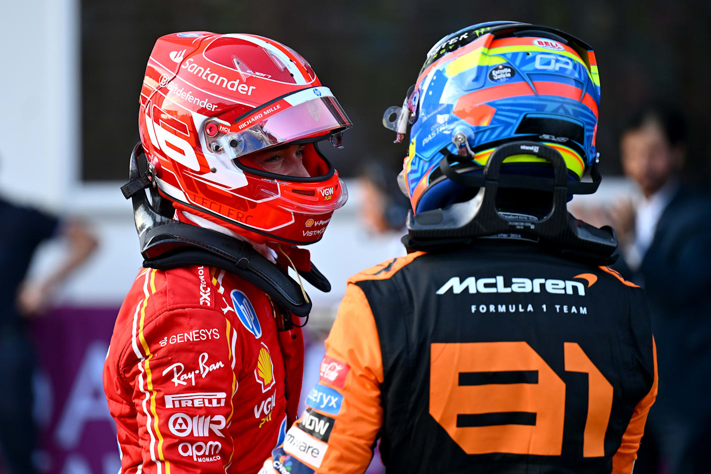 BAKU, AZERBAIJAN - SEPTEMBER 14: Pole position qualifier Charles Leclerc of Monaco and Ferrari and Second placed qualifier Oscar Piastri of Australia and McLaren talk in parc ferme during qualifying ahead of the F1 Grand Prix of Azerbaijan at Baku City Circuit on September 14, 2024 in Baku, Azerbaijan. (Photo by Dan Mullan/Getty Images)