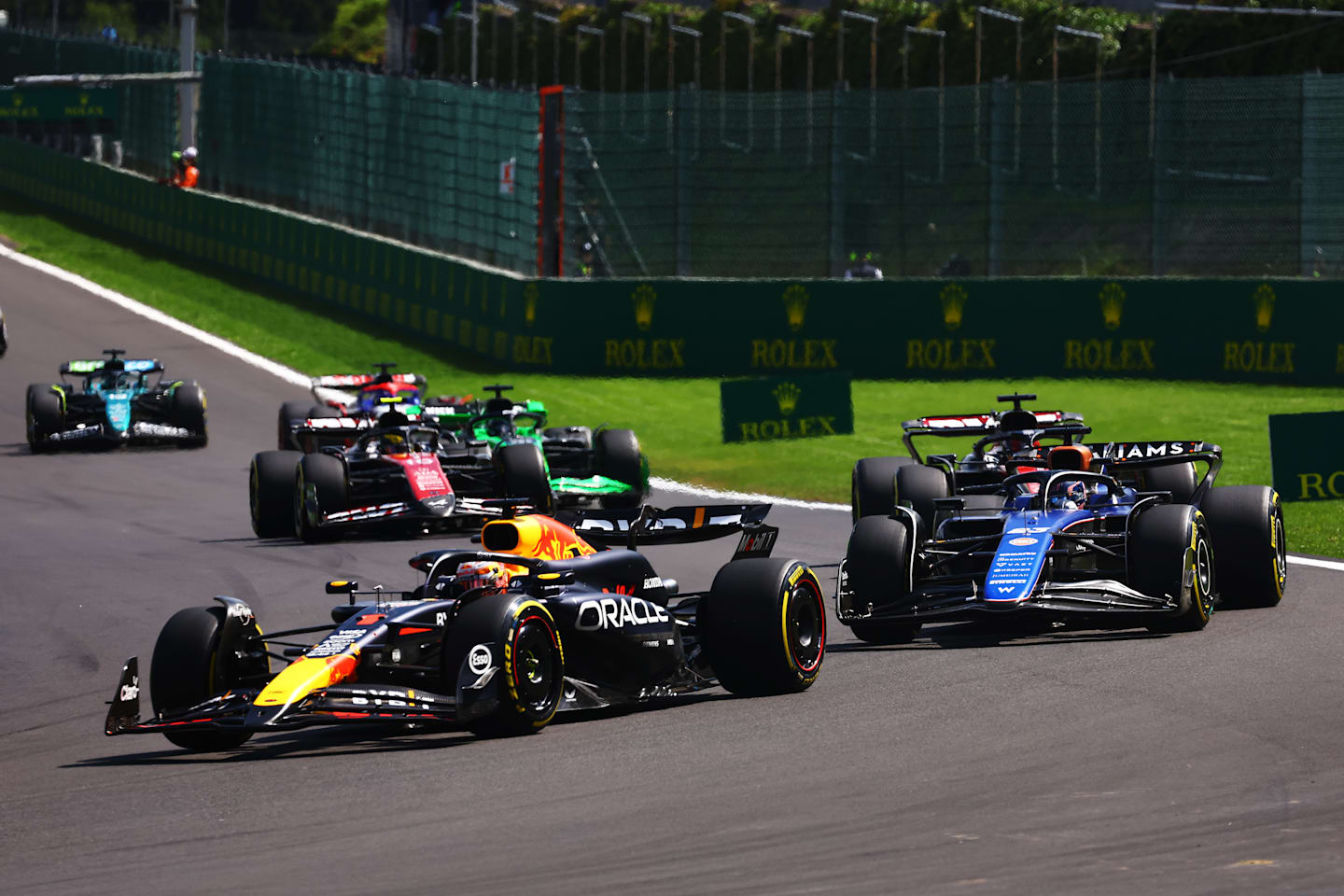 SPA, BELGIUM - JULY 28: Max Verstappen of the Netherlands driving the (1) Oracle Red Bull Racing RB20 leads Alexander Albon of Thailand driving the (23) Williams FW46 Mercedes during the F1 Grand Prix of Belgium at Circuit de Spa-Francorchamps on July 28, 2024 in Spa, Belgium. (Photo by Mark Thompson/Getty Images)