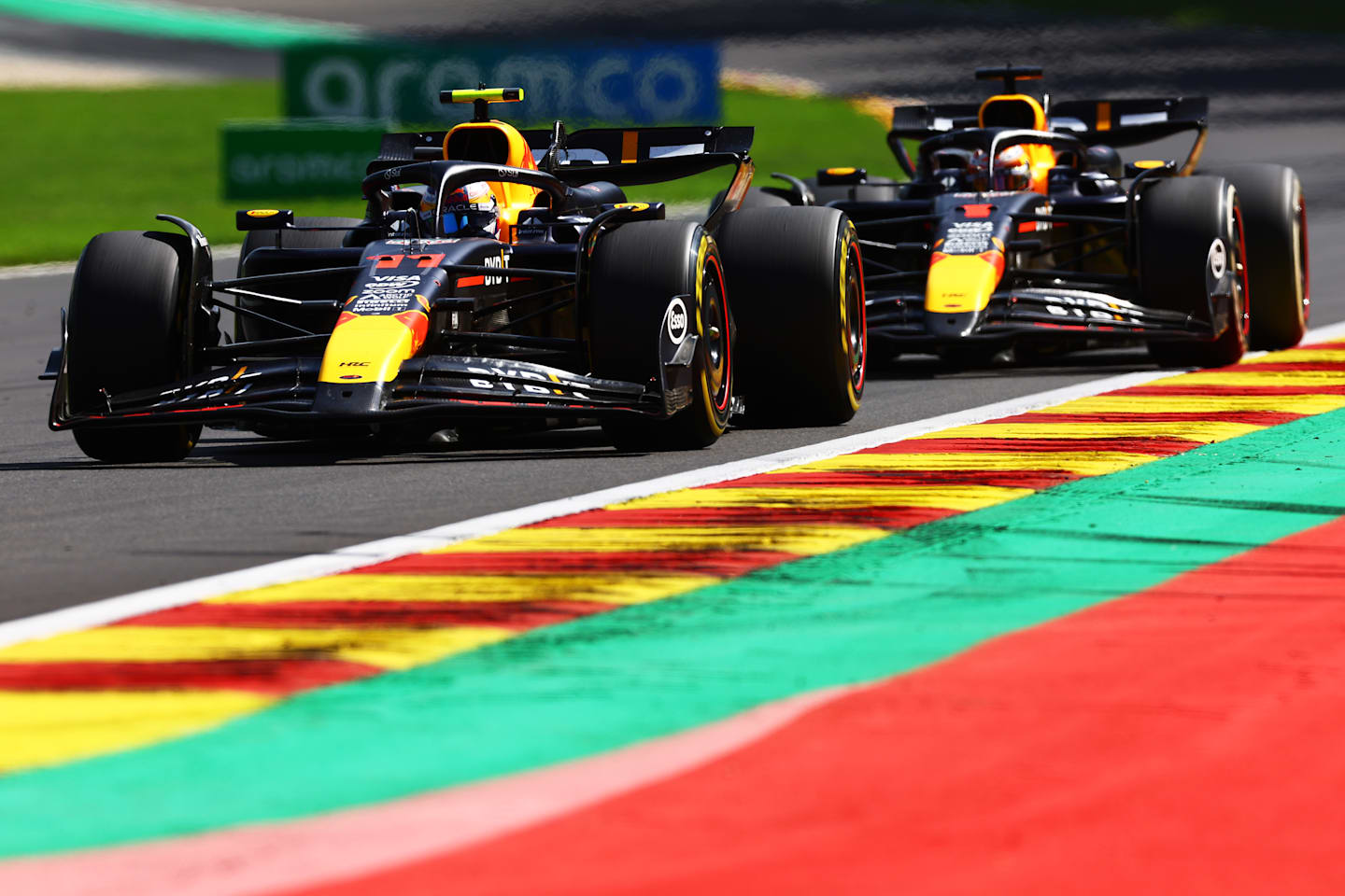 SPA, BELGIUM - JULY 28: Sergio Perez of Mexico driving the (11) Oracle Red Bull Racing RB20 leads Max Verstappen of the Netherlands driving the (1) Oracle Red Bull Racing RB20 during the F1 Grand Prix of Belgium at Circuit de Spa-Francorchamps on July 28, 2024 in Spa, Belgium. (Photo by Mark Thompson/Getty Images)