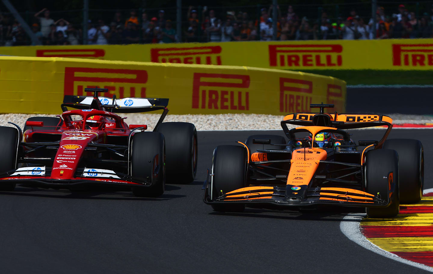 SPA, BELGIUM - JULY 28: Oscar Piastri of Australia driving the (81) McLaren MCL38 Mercedes overtakes Charles Leclerc of Monaco driving the (16) Ferrari SF-24 for third position during the F1 Grand Prix of Belgium at Circuit de Spa-Francorchamps on July 28, 2024 in Spa, Belgium. (Photo by Joe Portlock - Formula 1/Formula 1 via Getty Images)