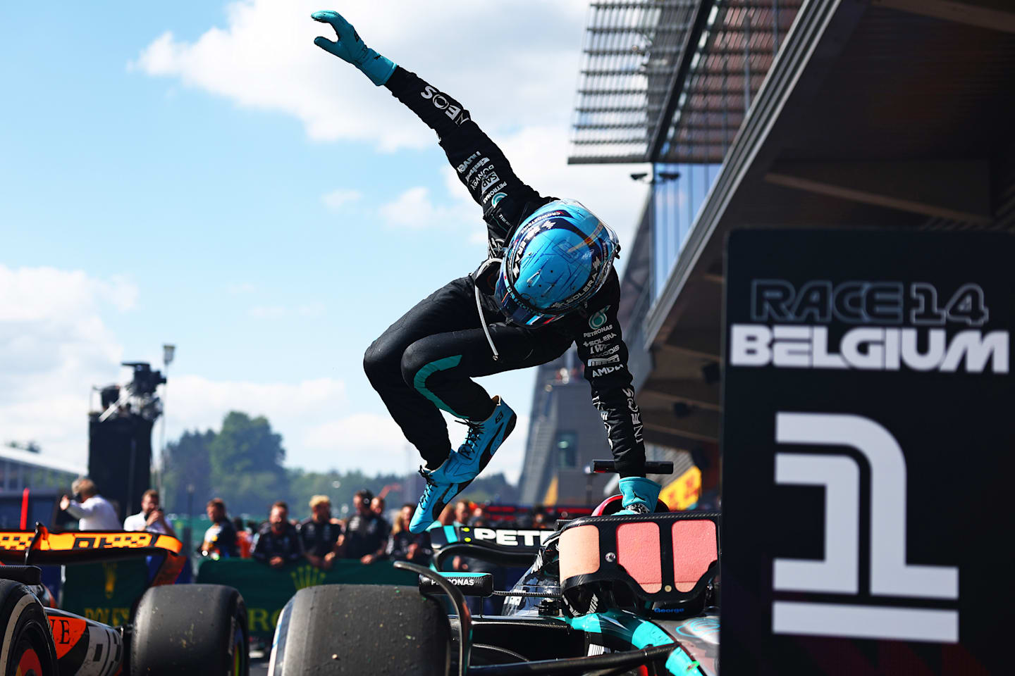 SPA, BELGIUM - JULY 28: Race winner George Russell of Great Britain and Mercedes jumps out of his car as he celebrates in parc ferme during the F1 Grand Prix of Belgium at Circuit de Spa-Francorchamps on July 28, 2024 in Spa, Belgium. (Photo by Bryn Lennon - Formula 1/Formula 1 via Getty Images)