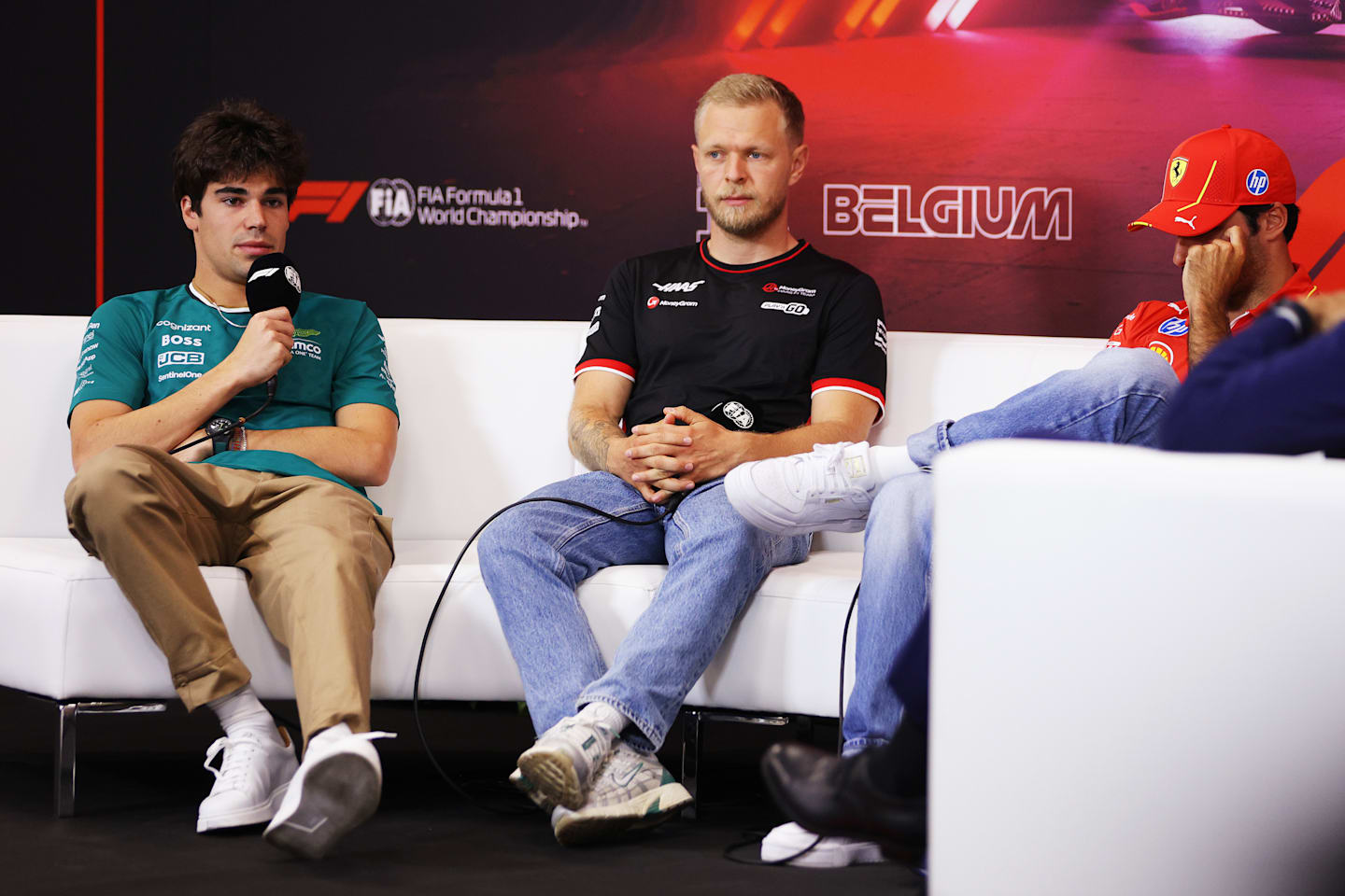 SPA, BELGIUM - JULY 25: Lance Stroll of Canada and Aston Martin F1 Team talks in the Drivers Press Conference with Kevin Magnussen of Denmark and Haas F1 during previews ahead of the F1 Grand Prix of Belgium at Circuit de Spa-Francorchamps on July 25, 2024 in Spa, Belgium. (Photo by Dean Mouhtaropoulos/Getty Images)