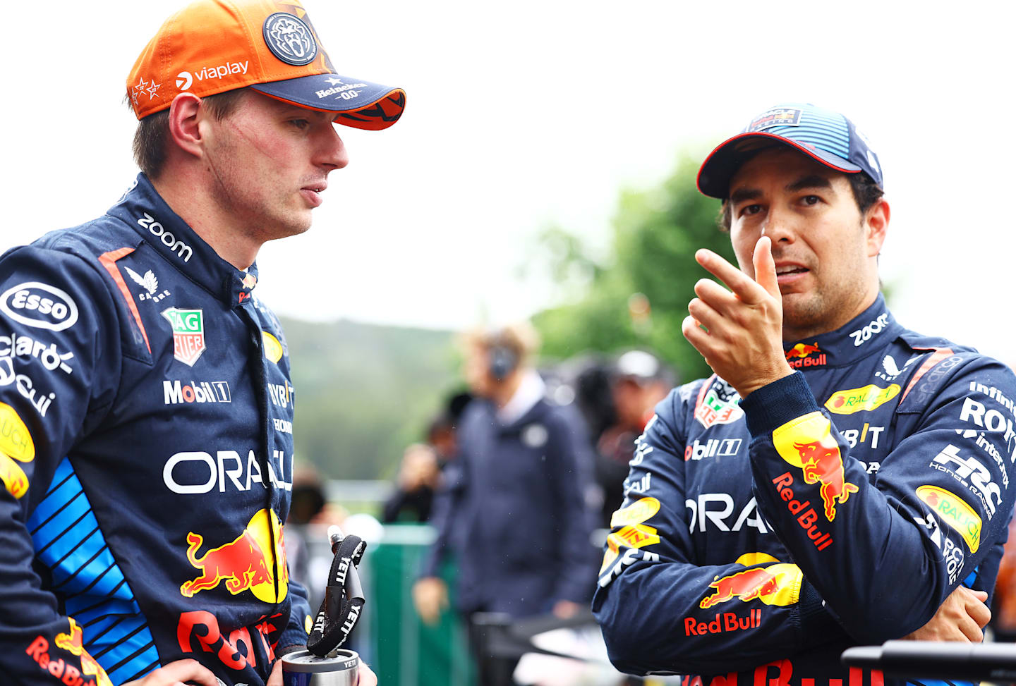 SPA, BELGIUM - JULY 27: Pole position qualifier Max Verstappen of the Netherlands and Oracle Red Bull Racing and Third placed qualifier Sergio Perez of Mexico and Oracle Red Bull Racing talk in parc ferme during qualifying ahead of the F1 Grand Prix of Belgium at Circuit de Spa-Francorchamps on July 27, 2024 in Spa, Belgium. (Photo by Mark Thompson/Getty Images)