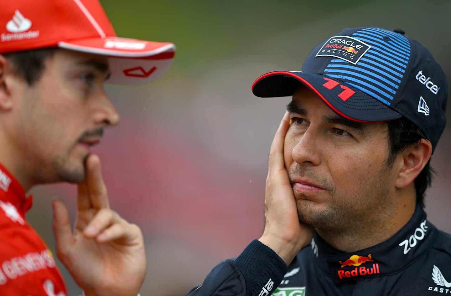 SPA, BELGIUM - JULY 27: Third placed qualifier Sergio Perez of Mexico and Oracle Red Bull Racing and Second placed qualifier Charles Leclerc of Monaco and Ferrari talk in parc ferme during qualifying ahead of the F1 Grand Prix of Belgium at Circuit de Spa-Francorchamps on July 27, 2024 in Spa, Belgium. (Photo by Rudy Carezzevoli/Getty Images)