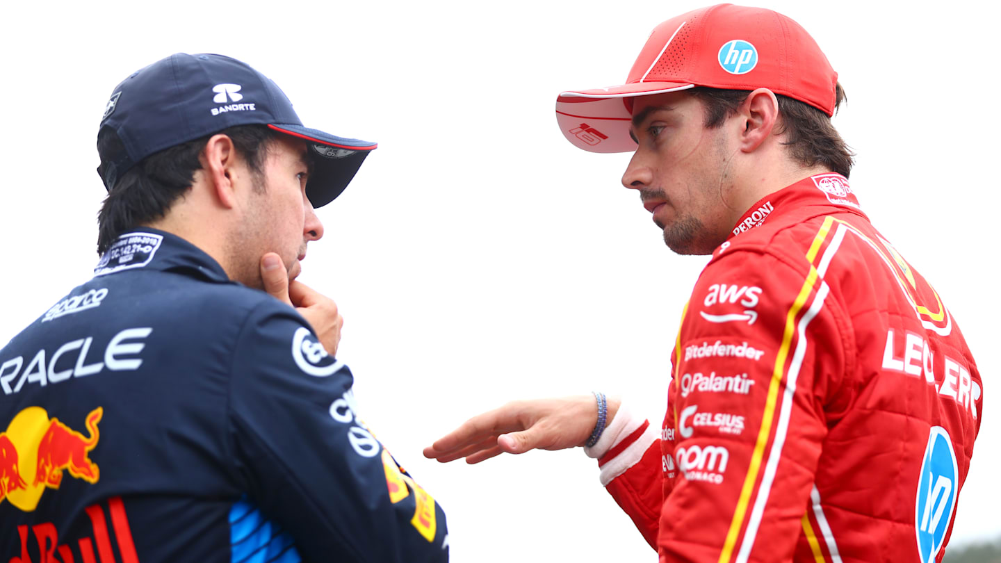 SPA, BELGIUM - JULY 27: Third placed qualifier Sergio Perez of Mexico and Oracle Red Bull Racing and Second placed qualifier Charles Leclerc of Monaco and Ferrari talk in parc ferme during qualifying ahead of the F1 Grand Prix of Belgium at Circuit de Spa-Francorchamps on July 27, 2024 in Spa, Belgium. (Photo by Bryn Lennon - Formula 1/Formula 1 via Getty Images)