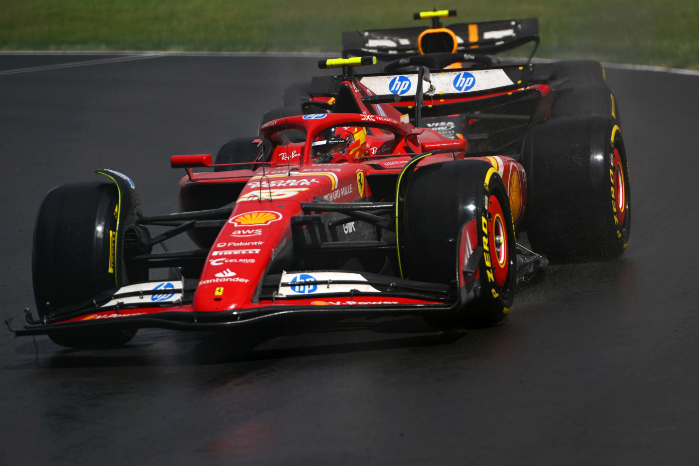MONTREAL, QUEBEC - JUNE 09: Carlos Sainz of Spain driving (55) the Ferrari SF-24 leads Sergio Perez of Mexico driving the (11) Oracle Red Bull Racing RB20 on track during the F1 Grand Prix of Canada at Circuit Gilles Villeneuve on June 09, 2024 in Montreal, Quebec. (Photo by Rudy Carezzevoli/Getty Images)