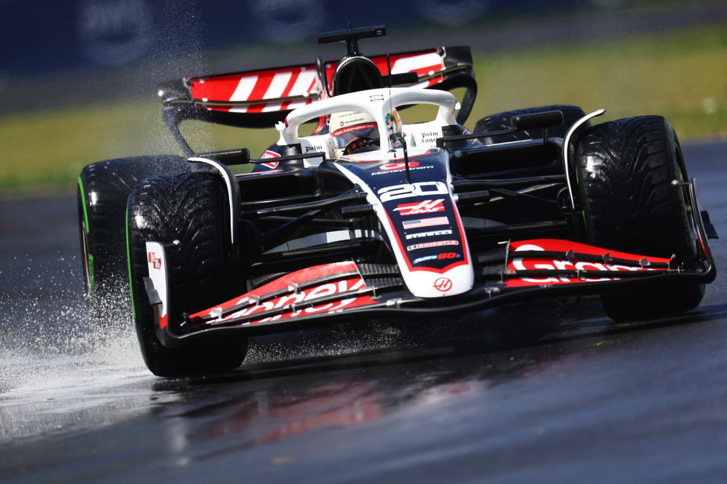MONTREAL, QUEBEC - JUNE 07: Kevin Magnussen of Denmark driving the (20) Haas F1 VF-24 Ferrari runs through a puddle on track during practice ahead of the F1 Grand Prix of Canada at Circuit Gilles Villeneuve on June 07, 2024 in Montreal, Quebec. (Photo by Clive Rose/Getty Images)