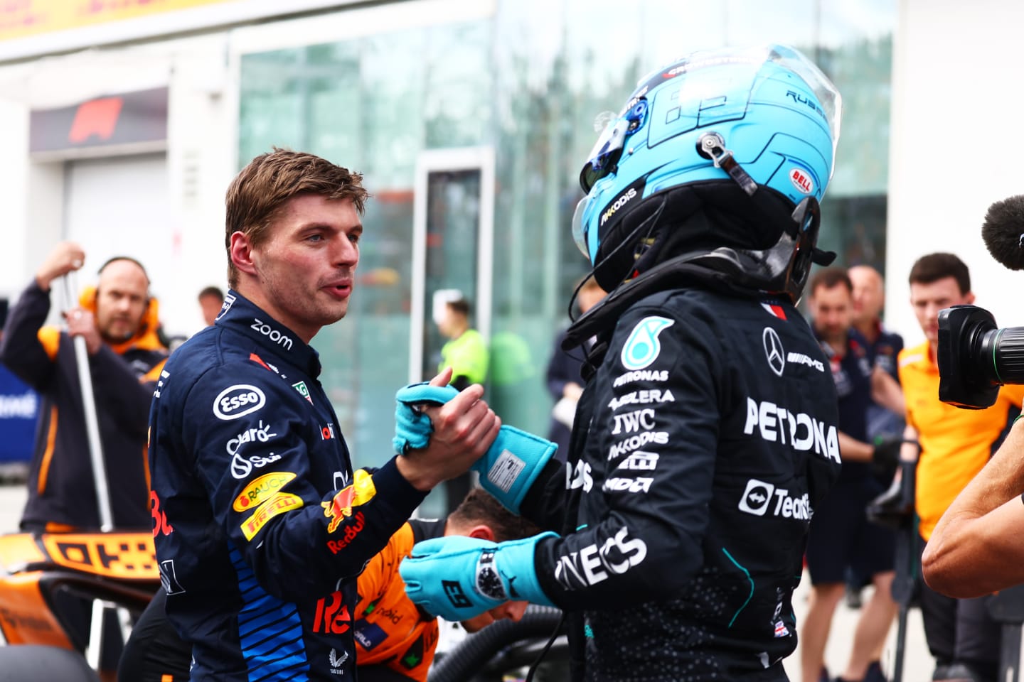 MONTREAL, QUEBEC - JUNE 08: Pole position qualifier George Russell of Great Britain and Mercedes and Second placed qualifier Max Verstappen of the Netherlands and Oracle Red Bull Racing celebrate in parc ferme during qualifying ahead of the F1 Grand Prix of Canada at Circuit Gilles Villeneuve on June 08, 2024 in Montreal, Quebec. (Photo by Mark Thompson/Getty Images)