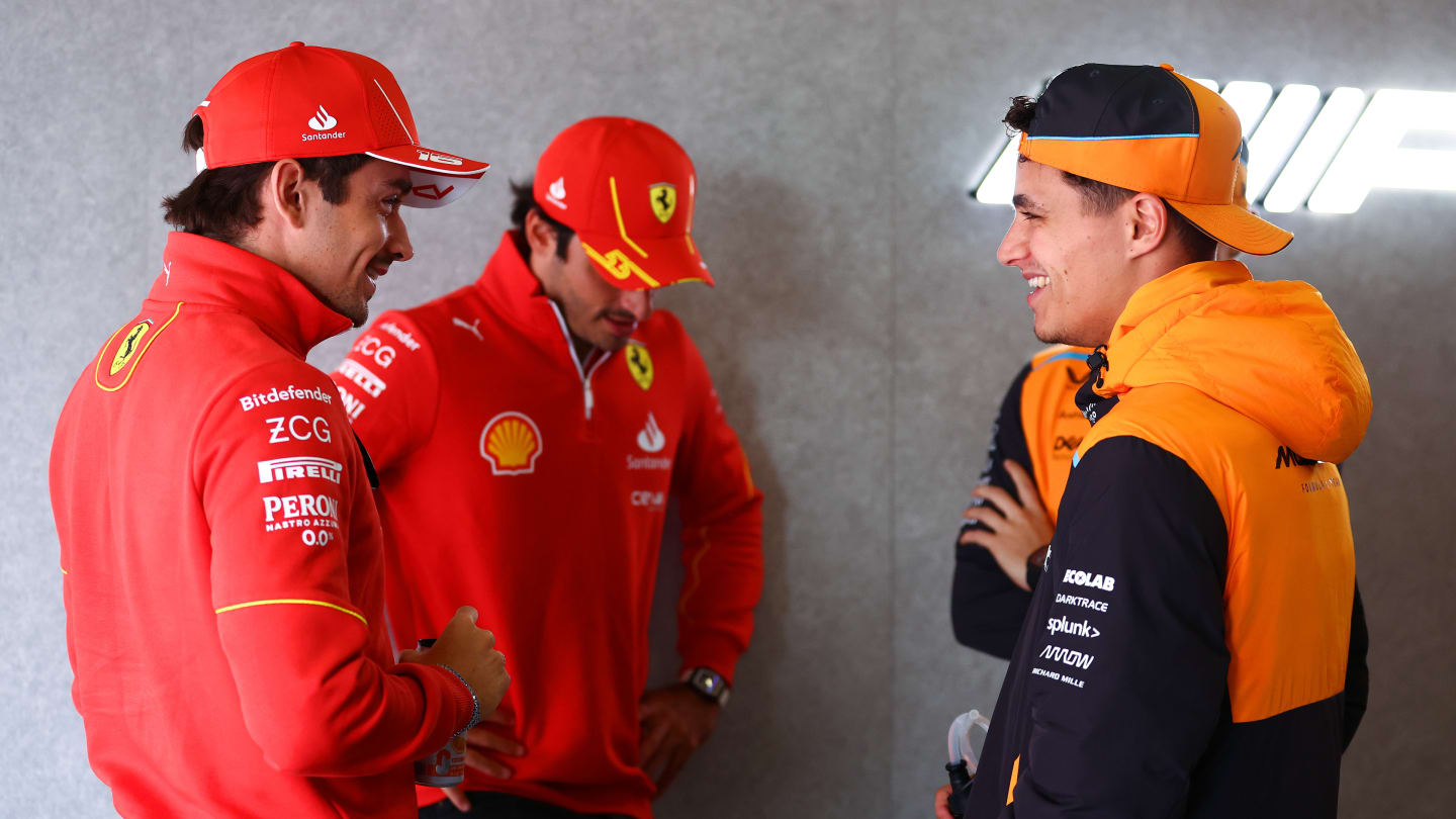 SHANGHAI, CHINA - APRIL 21: Lando Norris of Great Britain and McLaren, Charles Leclerc of Monaco and Ferrari and Carlos Sainz of Spain and Ferrari talk during the drivers parade prior to the F1 Grand Prix of China at Shanghai International Circuit on April 21, 2024 in Shanghai, China. (Photo by Bryn Lennon - Formula 1/Formula 1 via Getty Images)