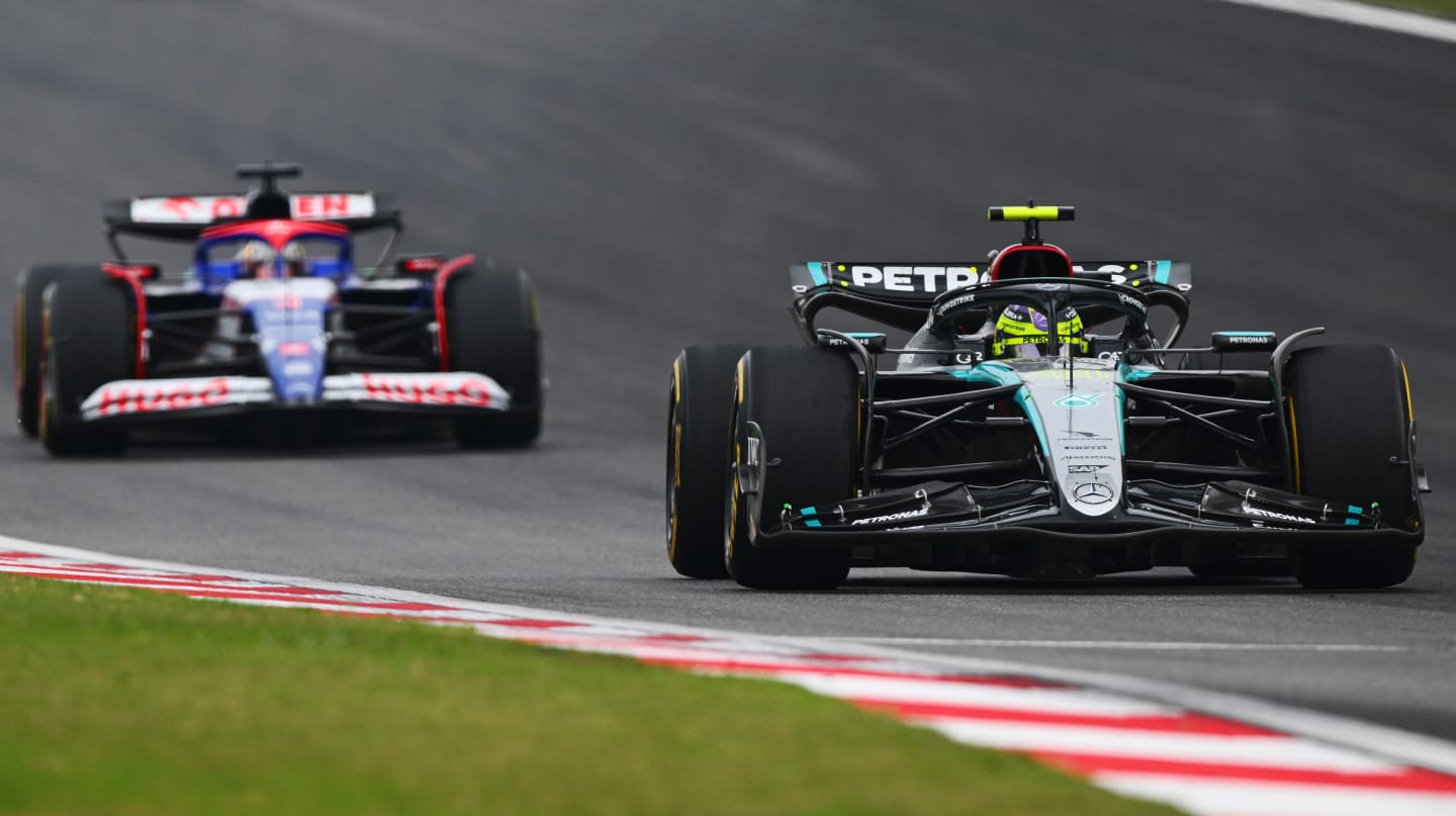 SHANGHAI, CHINA - APRIL 21: Lewis Hamilton of Great Britain driving the (44) Mercedes AMG Petronas F1 Team W15 leads Daniel Ricciardo of Australia driving the (3) Visa Cash App RB VCARB 01 on track during the F1 Grand Prix of China at Shanghai International Circuit on April 21, 2024 in Shanghai, China. (Photo by Clive Mason - Formula 1/Formula 1 via Getty Images)