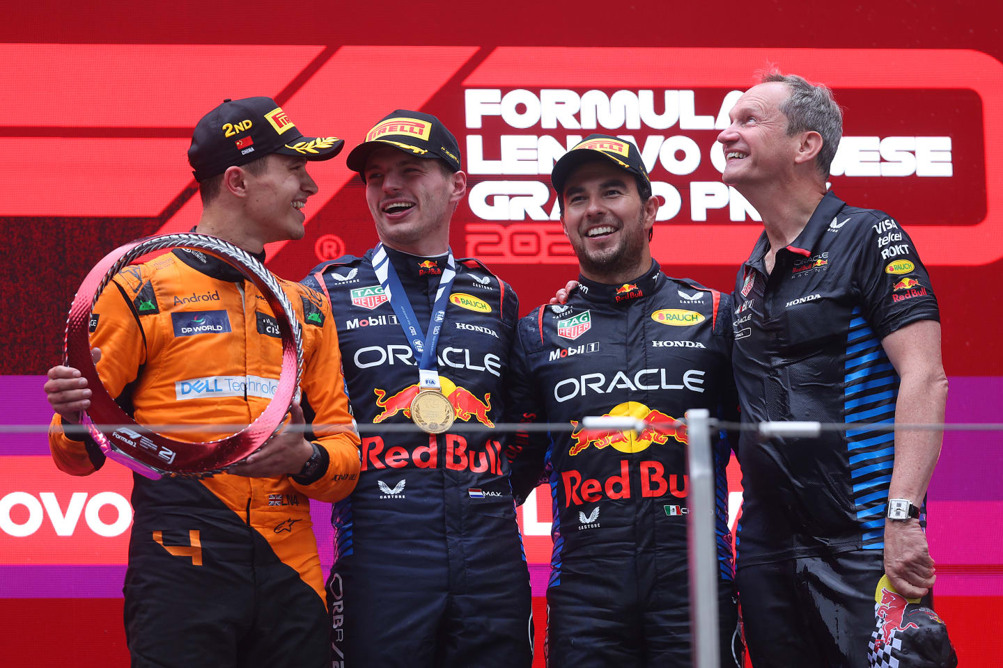 SHANGHAI, CHINA - APRIL 21: Race winner Max Verstappen of the Netherlands and Oracle Red Bull Racing, Second placed Lando Norris of Great Britain and McLaren, Third placed Sergio Perez of Mexico and Oracle Red Bull Racing and Oracle Red Bull Racing Head of Car Engineering Paul Monaghan celebrate on the podium during the F1 Grand Prix of China at Shanghai International Circuit on April 21, 2024 in Shanghai, China. (Photo by Lars Baron/Getty Images)