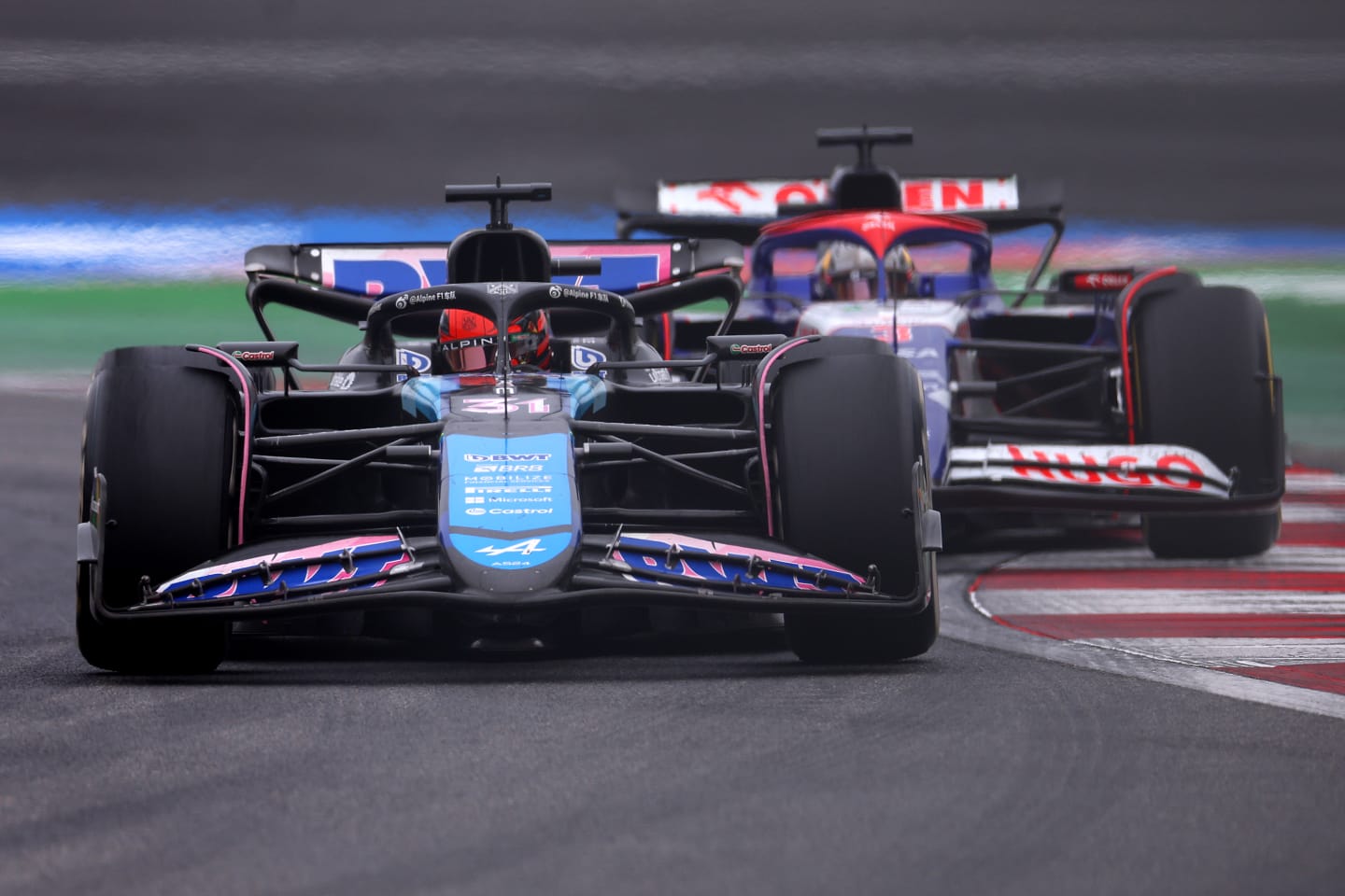 SHANGHAI, CHINA - APRIL 21: Esteban Ocon of France driving the (31) Alpine F1 A524 Renault leads Daniel Ricciardo of Australia driving the (3) Visa Cash App RB VCARB 01 on track during the F1 Grand Prix of China at Shanghai International Circuit on April 21, 2024 in Shanghai, China. (Photo by Lars Baron/Getty Images)