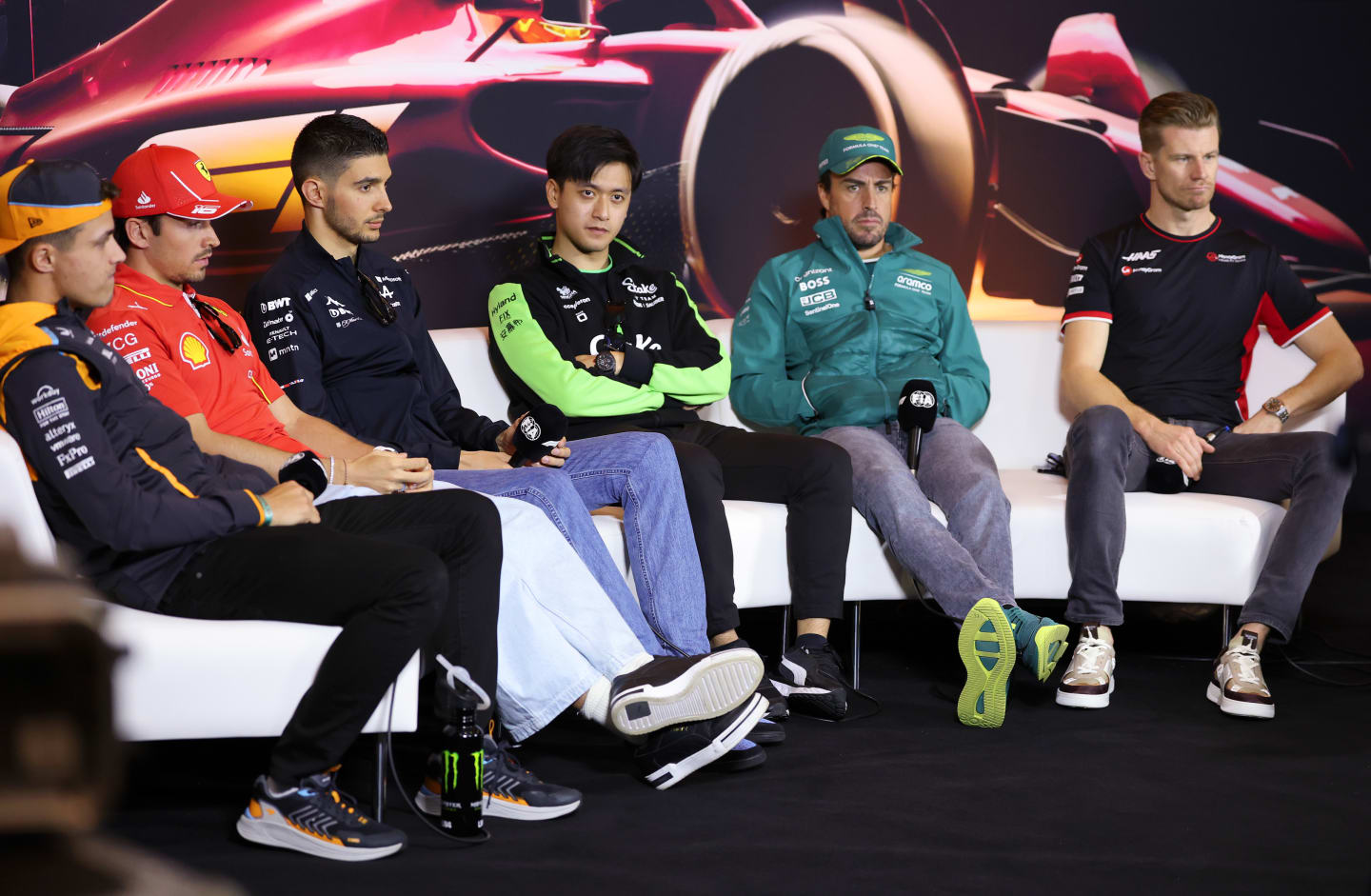 SHANGHAI, CHINA - APRIL 18: Lando Norris of Great Britain and McLaren, Charles Leclerc of Monaco and Ferrari, Esteban Ocon of France and Alpine F1, Zhou Guanyu of China and Stake F1 Team Kick Sauber, Fernando Alonso of Spain and Aston Martin F1 Team and Nico Hulkenberg of Germany and Haas F1 attend the Drivers Press Conference during previews ahead of the F1 Grand Prix of China at Shanghai International Circuit on April 18, 2024 in Shanghai, China. (Photo by Lintao Zhang/Getty Images )