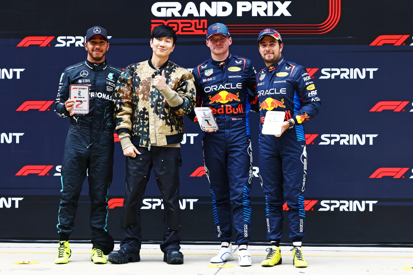 SHANGHAI, CHINA - APRIL 20: Sprint winner Max Verstappen of the Netherlands and Oracle Red Bull Racing, Second placed Lewis Hamilton of Great Britain and Mercedes, Third placed Sergio Perez of Mexico and Oracle Red Bull Racing and JJ Lin celebrate in parc ferme during the Sprint ahead of the F1 Grand Prix of China at Shanghai International Circuit on April 20, 2024 in Shanghai, China. (Photo by Mark Thompson/Getty Images)