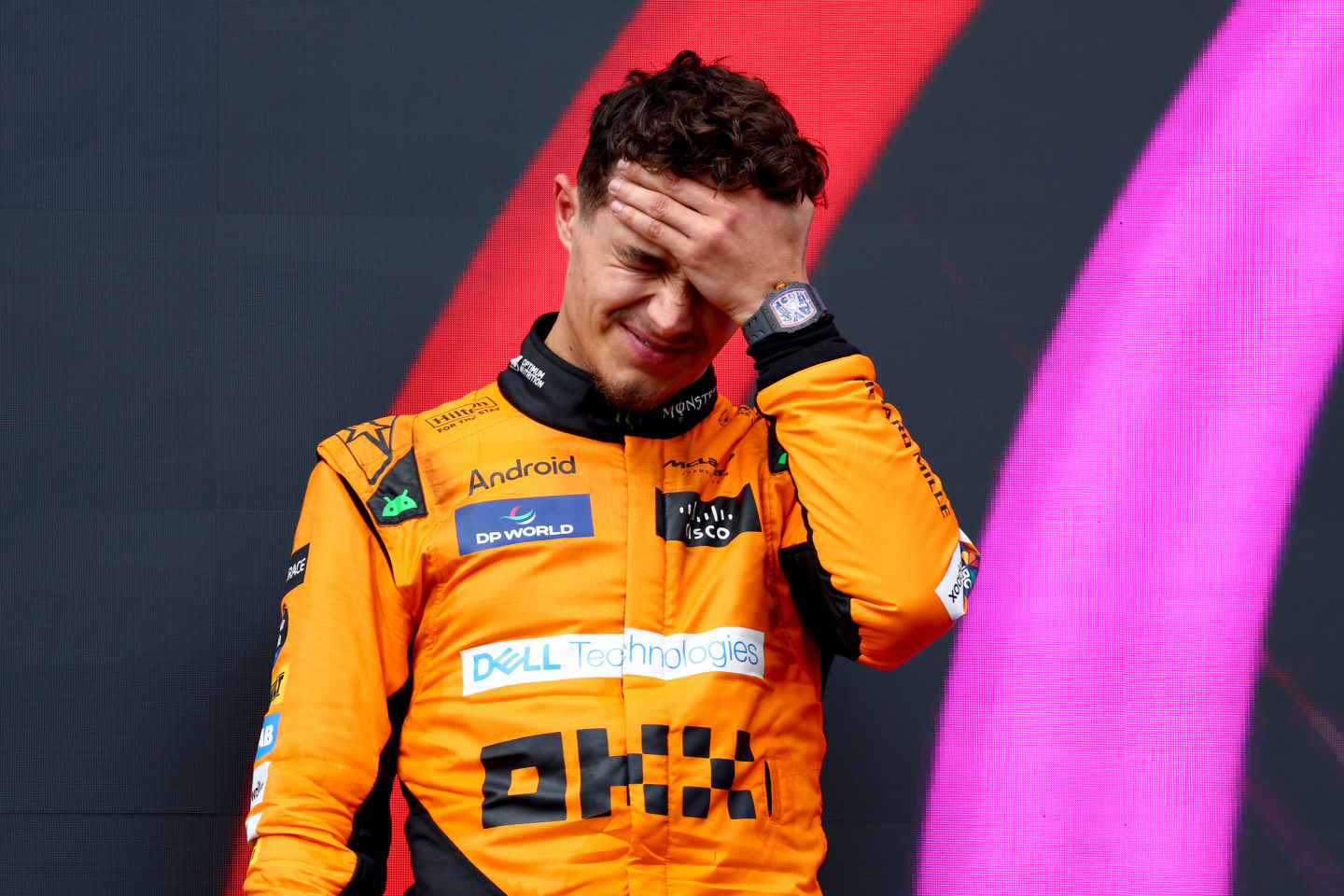 IMOLA, ITALY - MAY 19: Second placed Lando Norris of Great Britain and McLaren celebrates on the podium during the F1 Grand Prix of Emilia-Romagna at Autodromo Enzo e Dino Ferrari Circuit on May 19, 2024 in Imola, Italy. (Photo by Clive Rose/Getty Images)