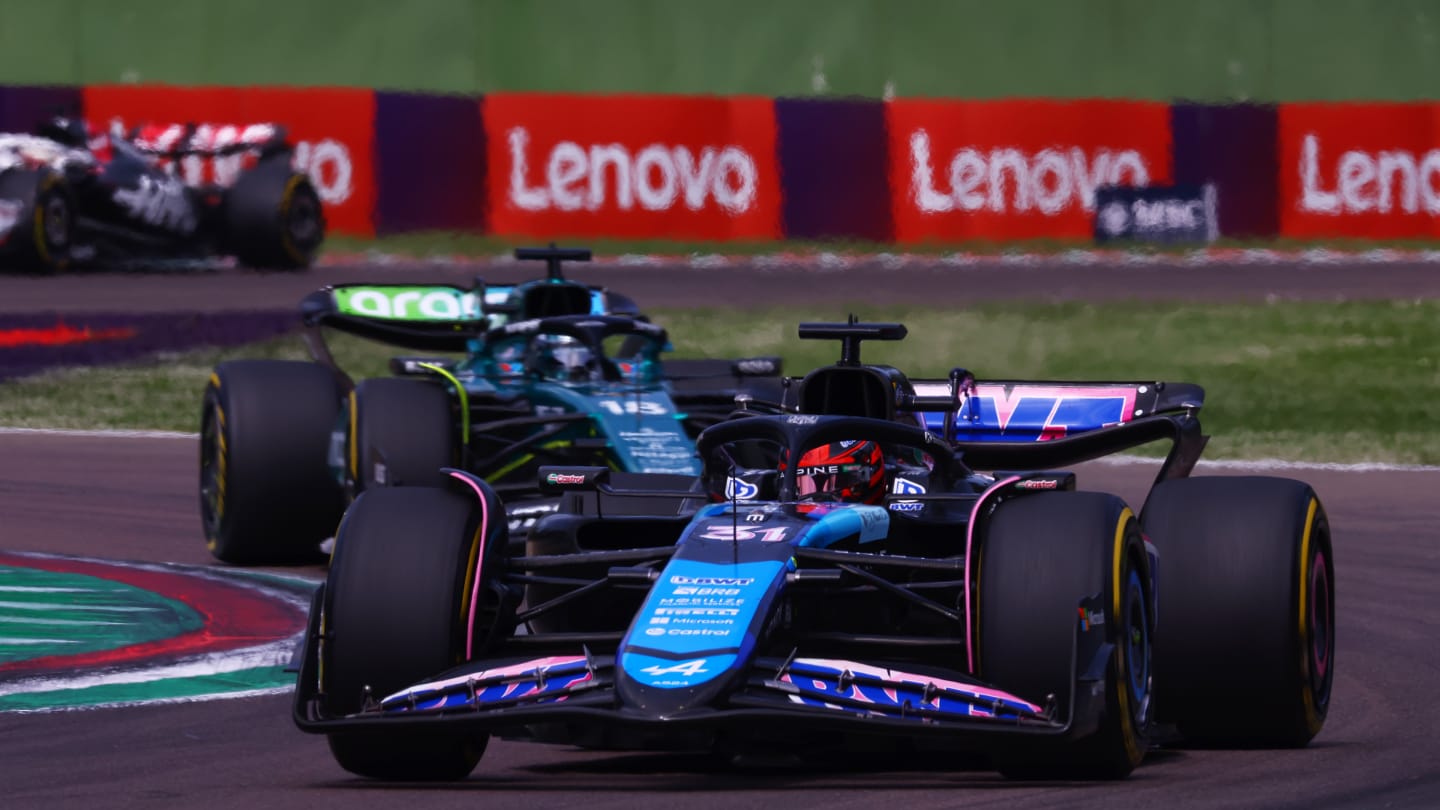 IMOLA, ITALY - MAY 19: Esteban Ocon of France driving the (31) Alpine F1 A524 Renault leads Lance Stroll of Canada driving the (18) Aston Martin AMR24 Mercedes during the F1 Grand Prix of Emilia-Romagna at Autodromo Enzo e Dino Ferrari Circuit on May 19, 2024 in Imola, Italy. (Photo by Bryn Lennon - Formula 1/Formula 1 via Getty Images)