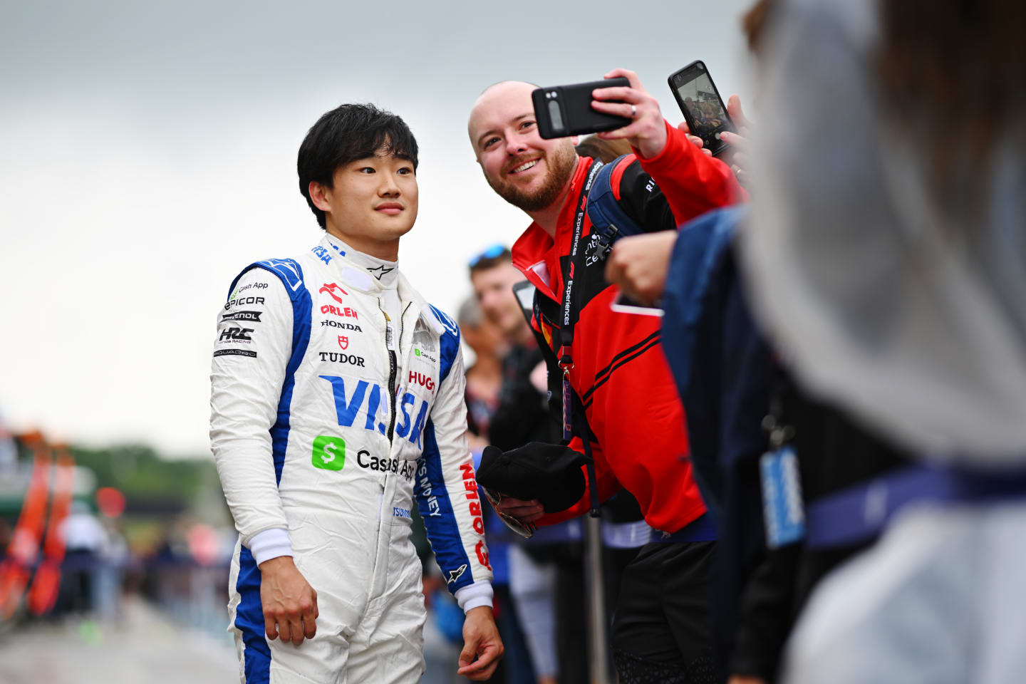 IMOLA, ITALY - MAY 16: Yuki Tsunoda of Japan and Visa Cash App RB greets fans in the Paddock during