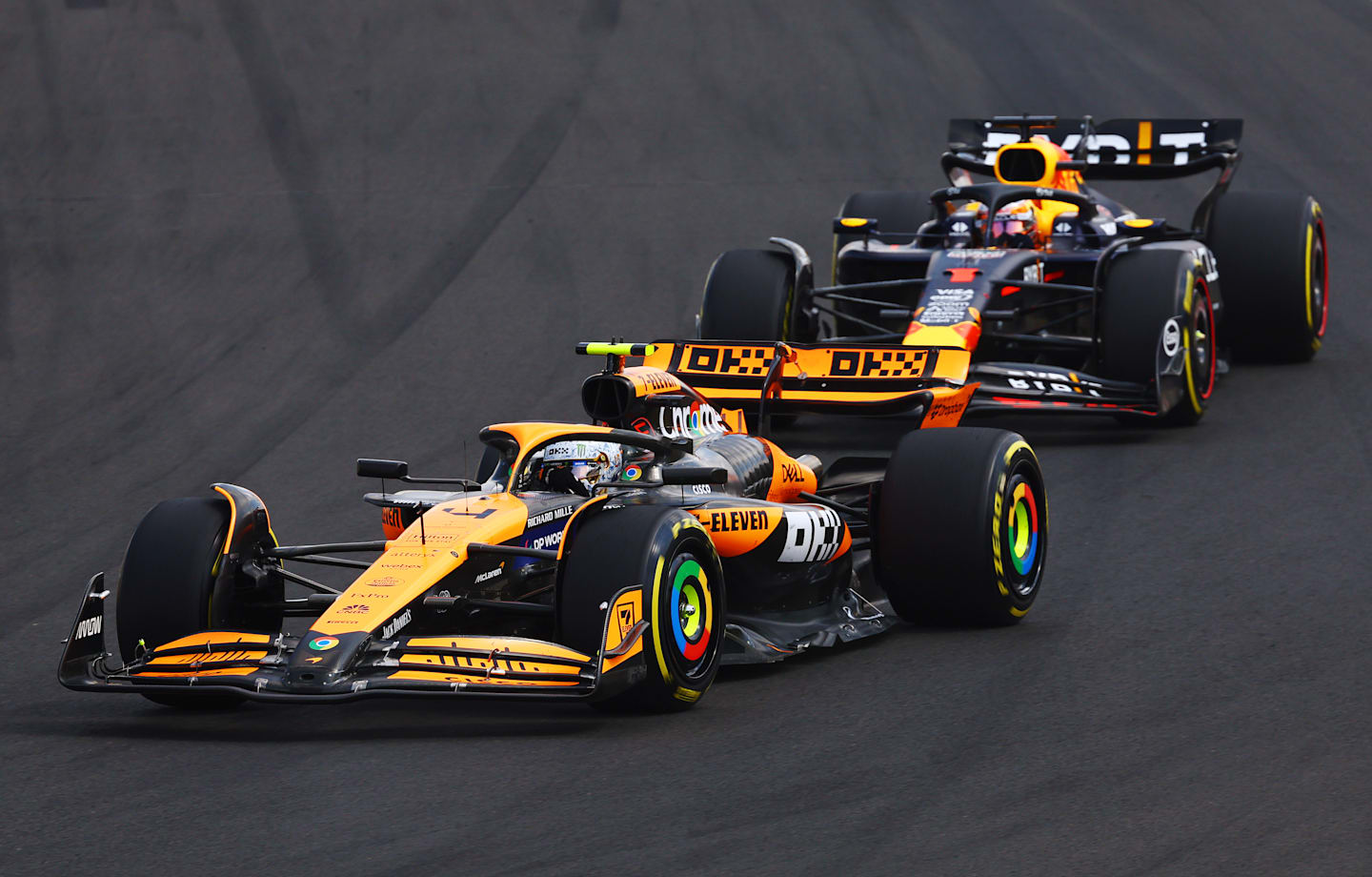 BUDAPEST, HUNGARY - JULY 21: Lando Norris of Great Britain driving the (4) McLaren MCL38 Mercedes leads Max Verstappen of the Netherlands driving the (1) Oracle Red Bull Racing RB20 during the F1 Grand Prix of Hungary at Hungaroring on July 21, 2024 in Budapest, Hungary. (Photo by Mark Thompson/Getty Images)