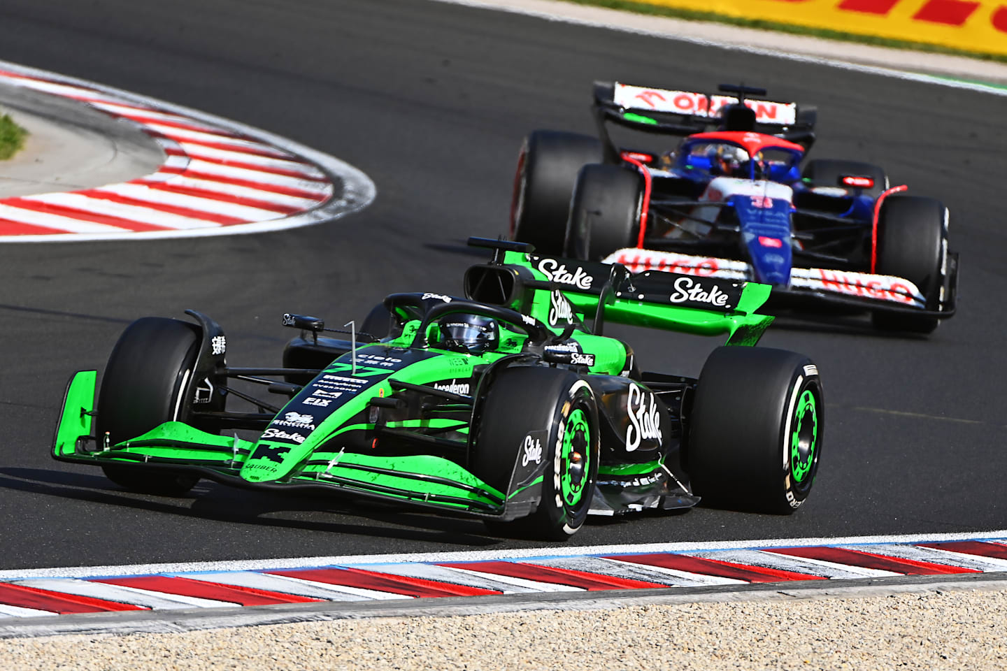 BUDAPEST, HUNGARY - JULY 21: Valtteri Bottas of Finland driving the (77) Kick Sauber C44 Ferrari leads Daniel Ricciardo of Australia driving the (3) Visa Cash App RB VCARB 01 on track during the F1 Grand Prix of Hungary at Hungaroring on July 21, 2024 in Budapest, Hungary. (Photo by James Sutton - Formula 1/Formula 1 via Getty Images)