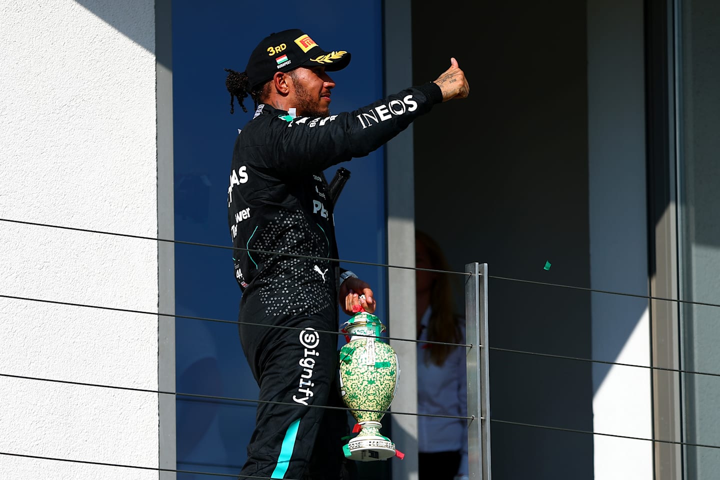 BUDAPEST, HUNGARY - JULY 21: Third placed Lewis Hamilton of Great Britain and Mercedes celebrates on the podium during the F1 Grand Prix of Hungary at Hungaroring on July 21, 2024 in Budapest, Hungary. (Photo by Joe Portlock - Formula 1/Formula 1 via Getty Images)