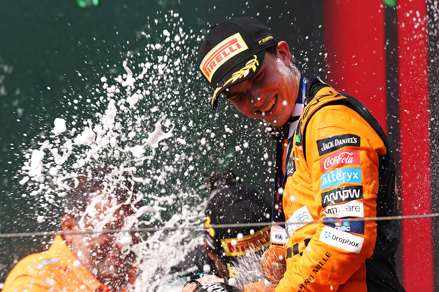 BUDAPEST, HUNGARY - JULY 21: Race winner Oscar Piastri of Australia and McLaren celebrates his maiden race win on the podium during the F1 Grand Prix of Hungary at Hungaroring on July 21, 2024 in Budapest, Hungary. (Photo by Dean Mouhtaropoulos/Getty Images)