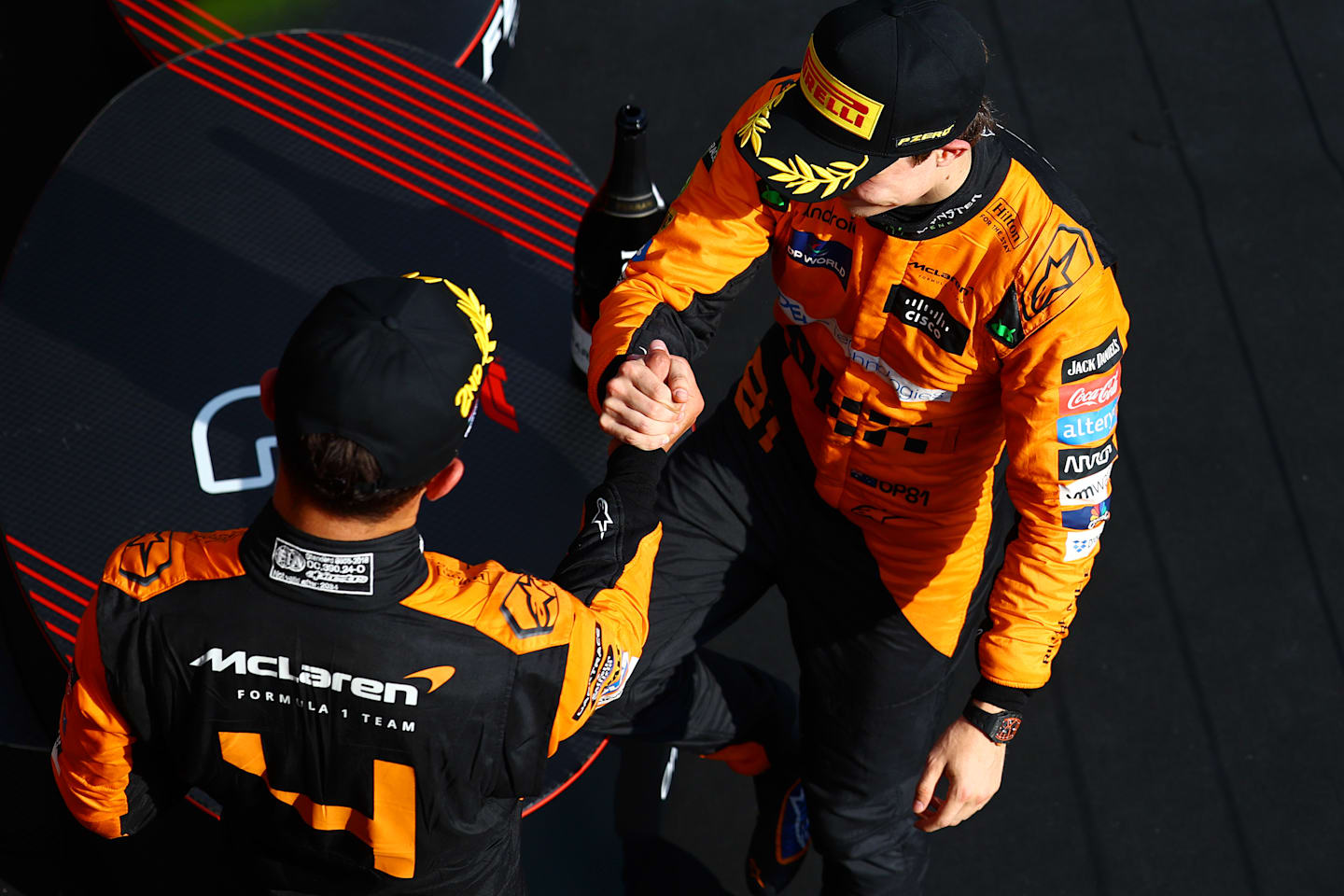 BUDAPEST, HUNGARY - JULY 21: Race winner Oscar Piastri of Australia and McLaren and Second placed Lando Norris of Great Britain and McLaren celebrate on the podium during the F1 Grand Prix of Hungary at Hungaroring on July 21, 2024 in Budapest, Hungary. (Photo by Mark Thompson/Getty Images)