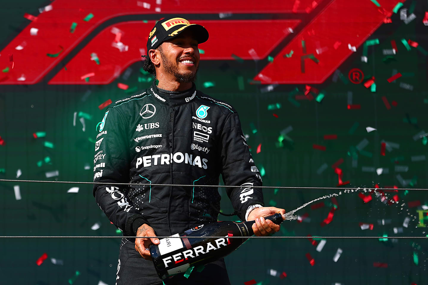 BUDAPEST, HUNGARY - JULY 21: Third placed Lewis Hamilton of Great Britain and Mercedes celebrates on the podium during the F1 Grand Prix of Hungary at Hungaroring on July 21, 2024 in Budapest, Hungary. (Photo by Joe Portlock - Formula 1/Formula 1 via Getty Images)