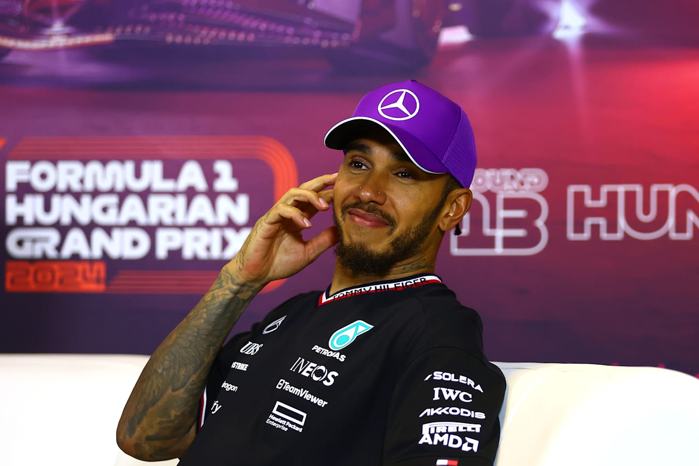 BUDAPEST, HUNGARY - JULY 21: Third placed Lewis Hamilton of Great Britain and Mercedes attends the