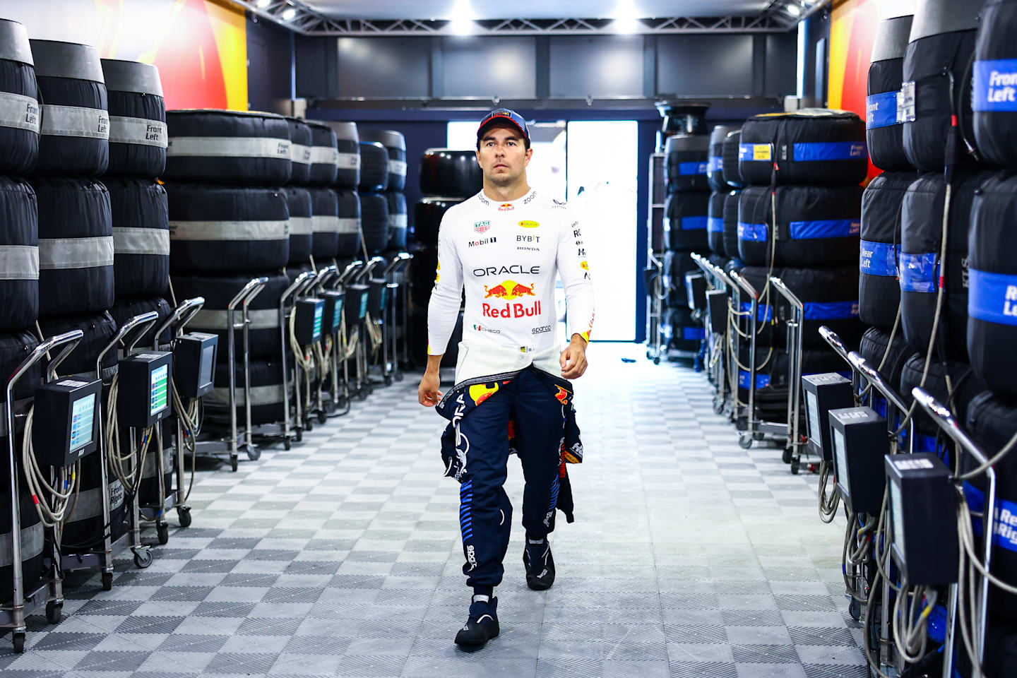 BUDAPEST, HUNGARY - JULY 20: Sergio Perez of Mexico and Oracle Red Bull Racing walks into the garage during qualifying ahead of the F1 Grand Prix of Hungary at Hungaroring on July 20, 2024 in Budapest, Hungary. (Photo by Mark Thompson/Getty Images)