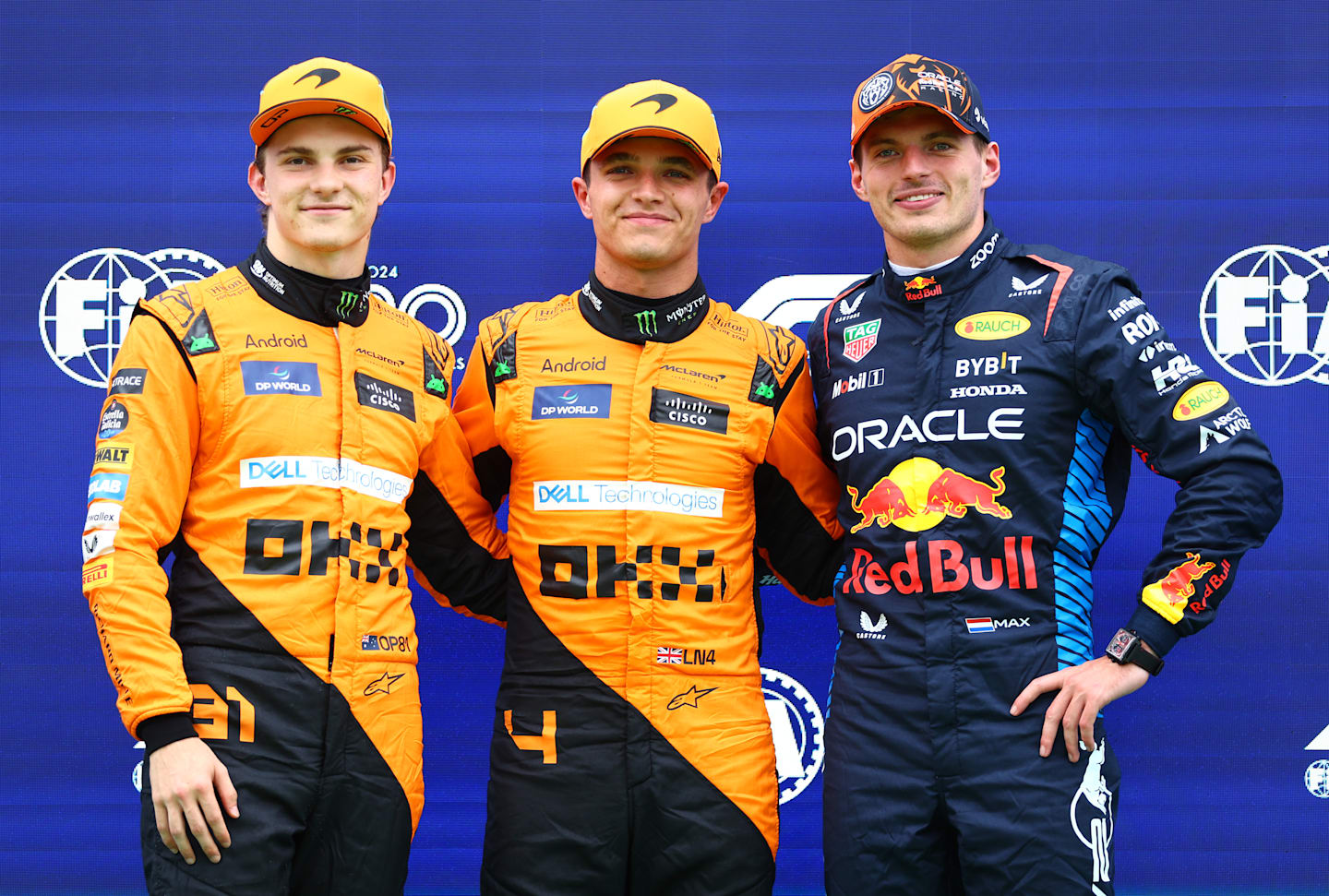 BUDAPEST, HUNGARY - JULY 20: Pole position qualifier Lando Norris of Great Britain and McLaren, Second placed qualifier Oscar Piastri of Australia and McLaren and Third placed qualifier Max Verstappen of the Netherlands and Oracle Red Bull Racing pose for a photo in parc ferme during qualifying ahead of the F1 Grand Prix of Hungary at Hungaroring on July 20, 2024 in Budapest, Hungary. (Photo by Bryn Lennon - Formula 1/Formula 1 via Getty Images)