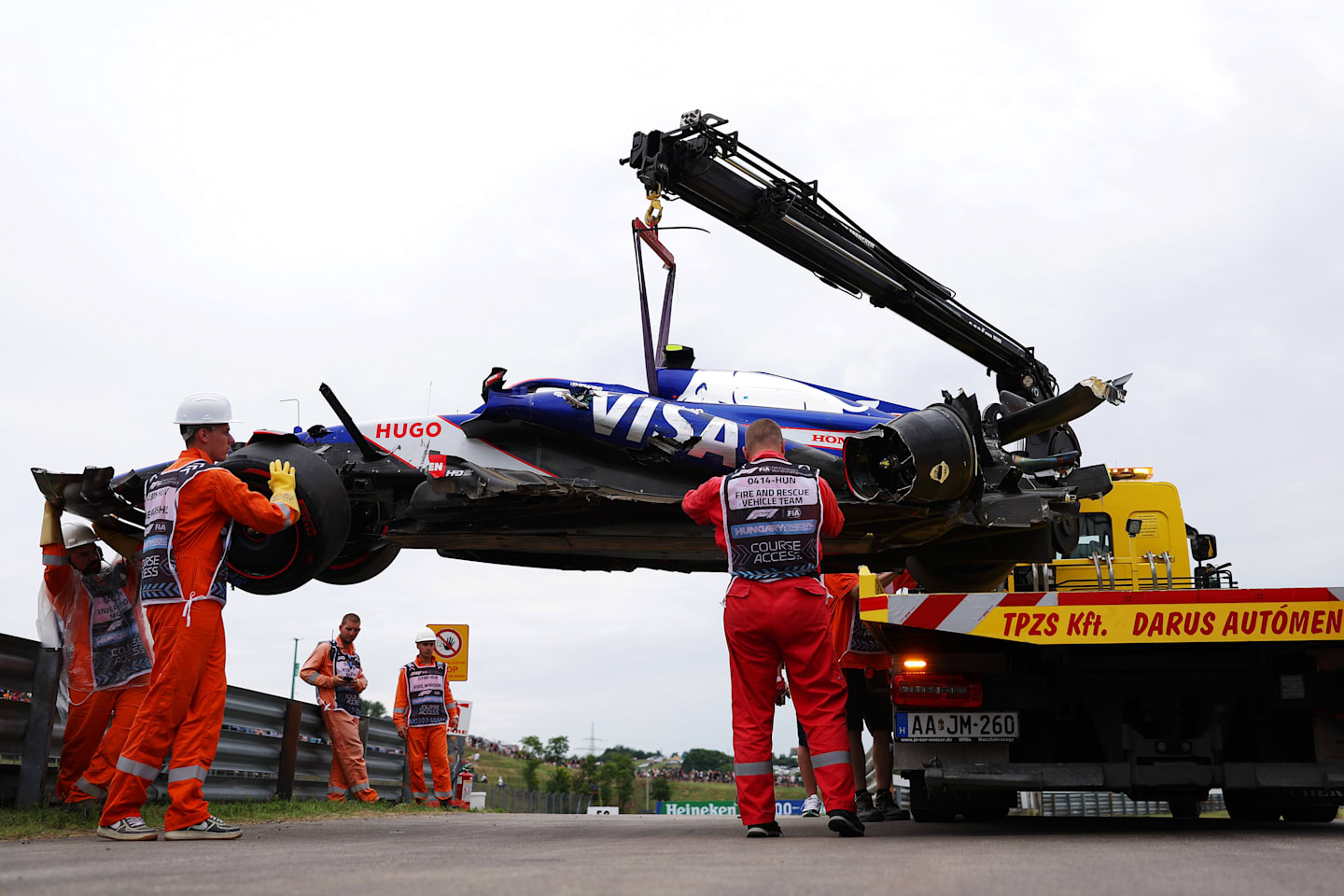 BUDAPEST, HUNGARY - JULY 20: The car of Yuki Tsunoda of Japan and Visa Cash App RB is recovered from the circuit after a crash during qualifying ahead of the F1 Grand Prix of Hungary at Hungaroring on July 20, 2024 in Budapest, Hungary. (Photo by Dean Mouhtaropoulos/Getty Images)