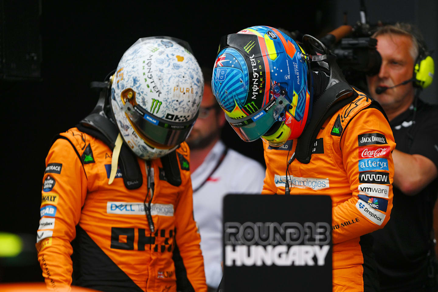 BUDAPEST, HUNGARY - JULY 20: Pole position qualifier Lando Norris of Great Britain and McLaren and Second placed qualifier Oscar Piastri of Australia and McLaren talk in parc ferme during qualifying ahead of the F1 Grand Prix of Hungary at Hungaroring on July 20, 2024 in Budapest, Hungary. (Photo by Rudy Carezzevoli/Getty Images)