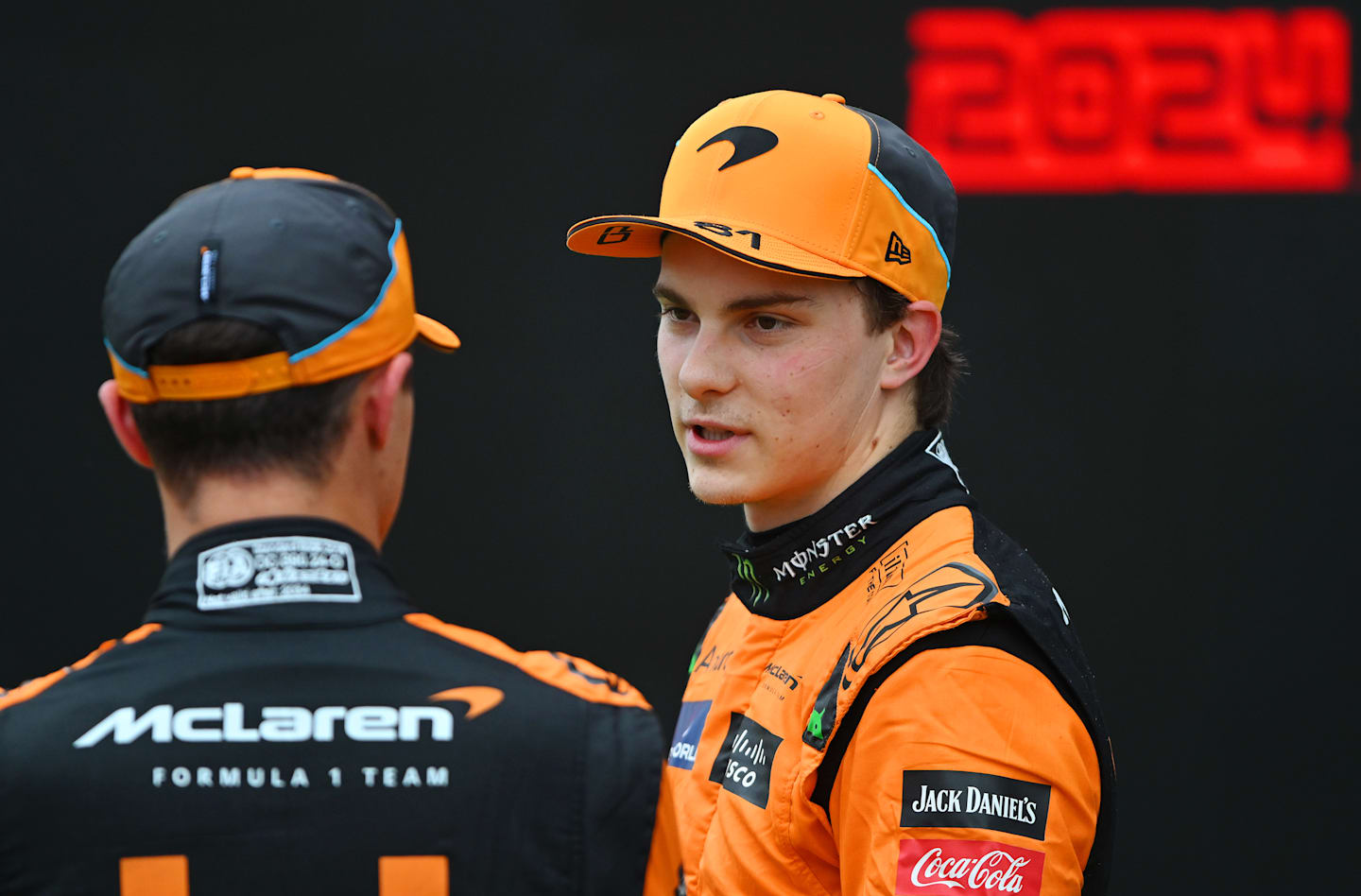 BUDAPEST, HUNGARY - JULY 20: Pole position qualifier Lando Norris of Great Britain and McLaren and Second placed qualifier Oscar Piastri of Australia and McLaren talk in parc ferme during qualifying ahead of the F1 Grand Prix of Hungary at Hungaroring on July 20, 2024 in Budapest, Hungary. (Photo by Rudy Carezzevoli/Getty Images)