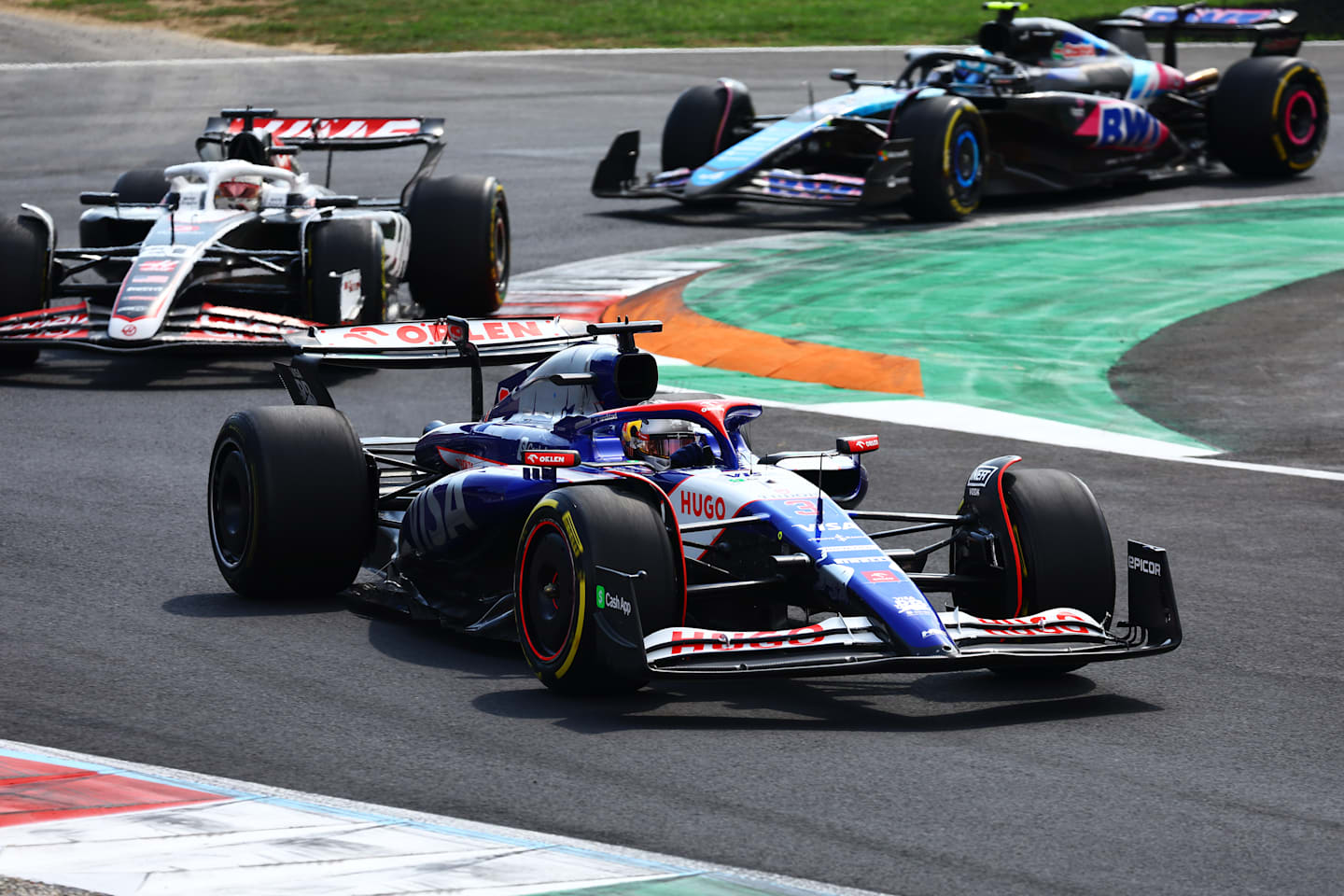 MONZA, ITALY - SEPTEMBER 01: Daniel Ricciardo of Australia driving the (3) Visa Cash App RB VCARB 01 leads Kevin Magnussen of Denmark driving the (20) Haas F1 VF-24 Ferrari on track during the F1 Grand Prix of Italy at Autodromo Nazionale Monza on September 01, 2024 in Monza, Italy. (Photo by Mark Thompson/Getty Images)