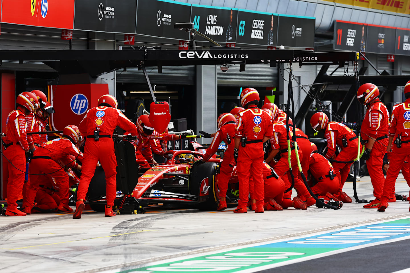 MONZA, ITALY - SEPTEMBER 01: Carlos Sainz of Spain driving (55) the Ferrari SF-24 stops in the Pitlane for a pit stop during the F1 Grand Prix of Italy at Autodromo Nazionale Monza on September 01, 2024 in Monza, Italy. (Photo by Mark Thompson/Getty Images)